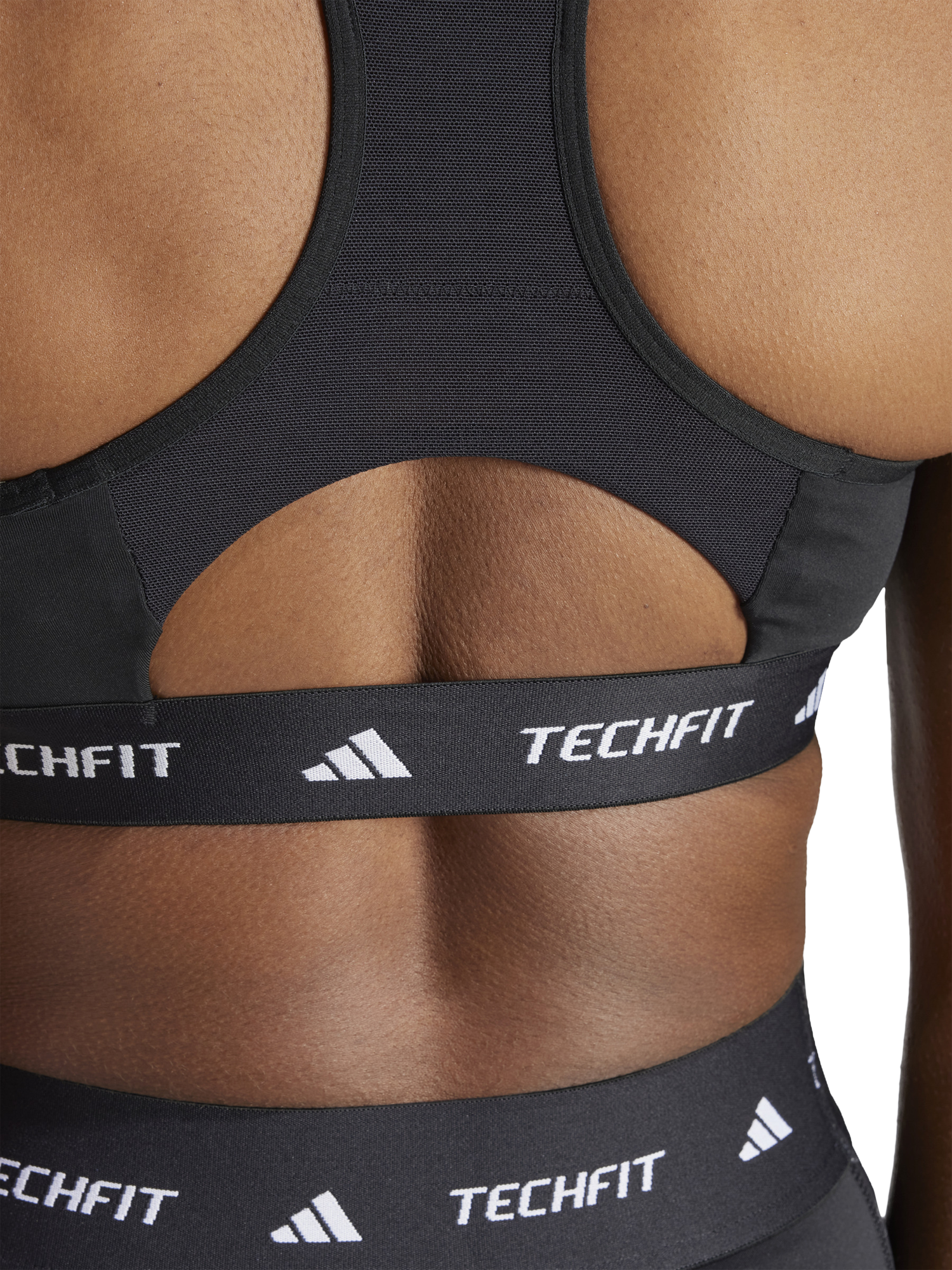 Product image 4 of 7, which shows adidas TECHFIT Sports Bra, Black, XS
