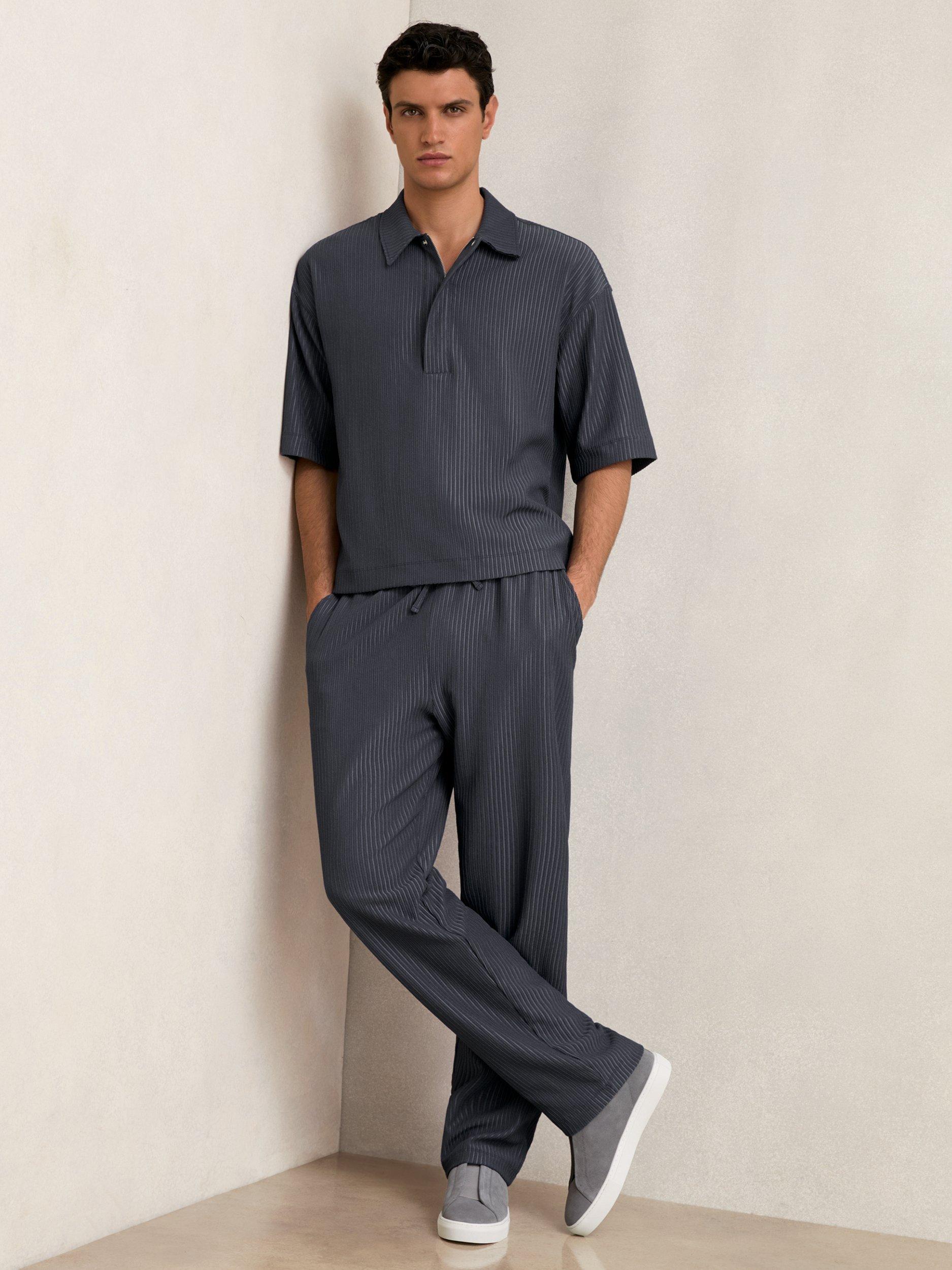 Product image 4 of 5, which shows Reiss Tobi Textured Zip Neck Polo Shirt, Petrol Blue, XS