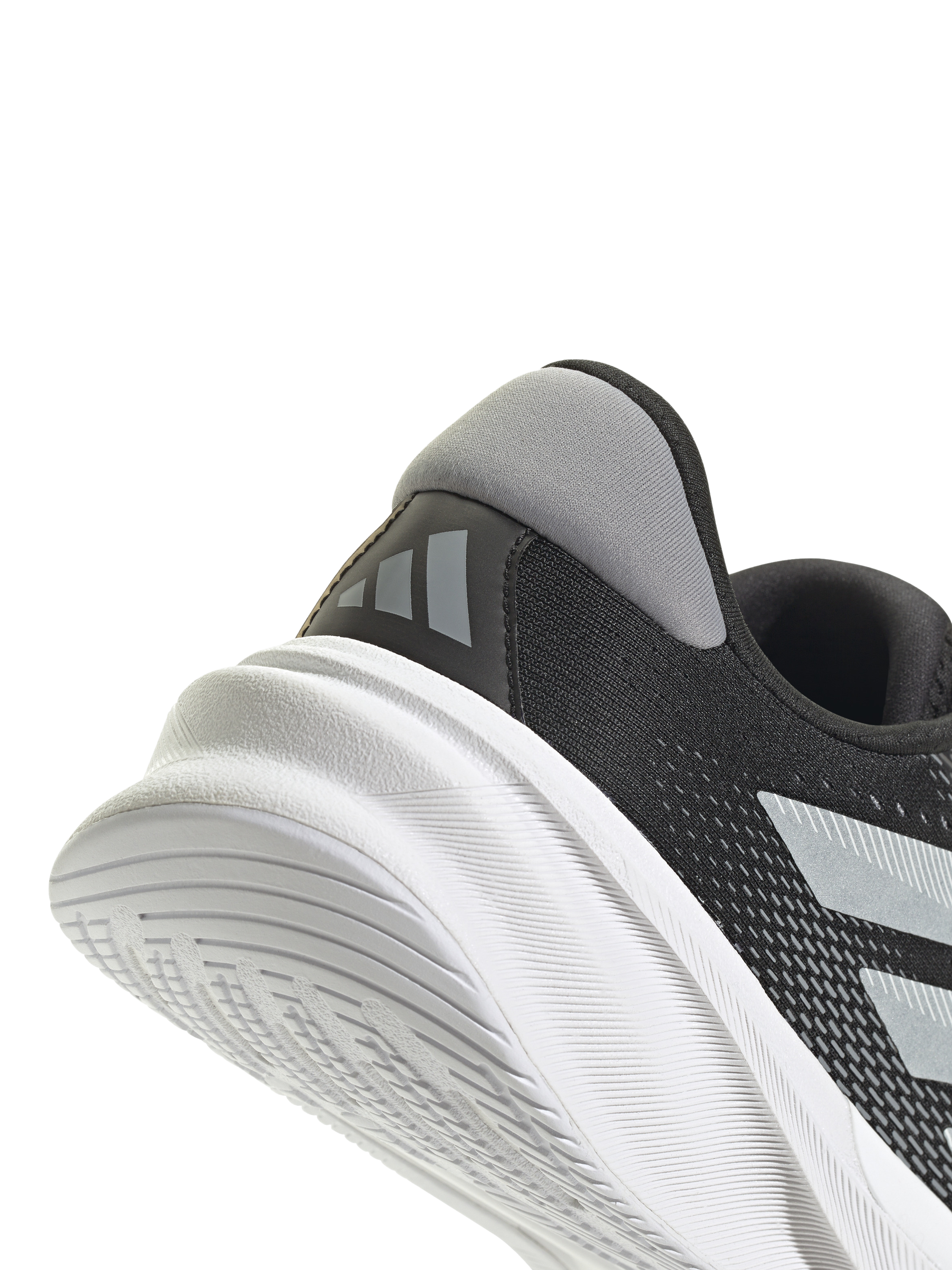 Product image 8 of 8, which shows adidas Women's Supernova Stride Running Shoes, Black/White, 4