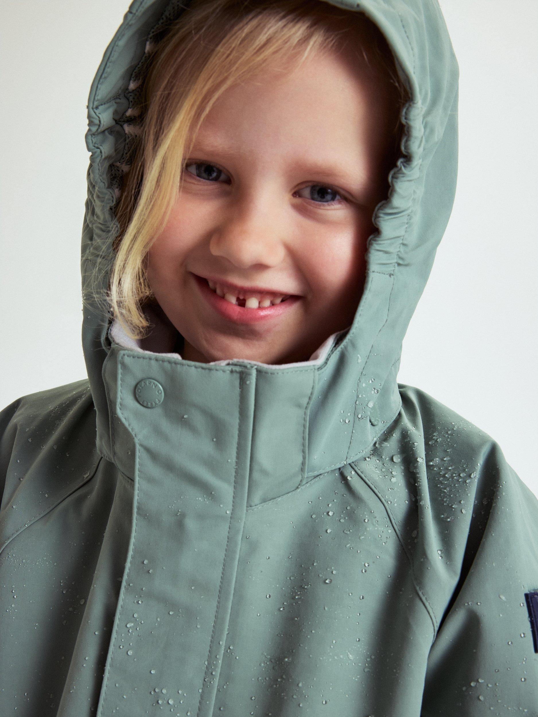 Product image 9 of 11, which shows Polarn O. Pyret Kids' Waterproof Shell Coat, Green, 3-4 years