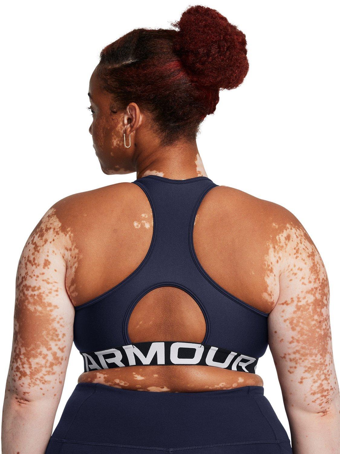 Product image 11 of 11, which shows Under Armour Logo Medium Impact Padded Sports Bra, Navy / White, XS