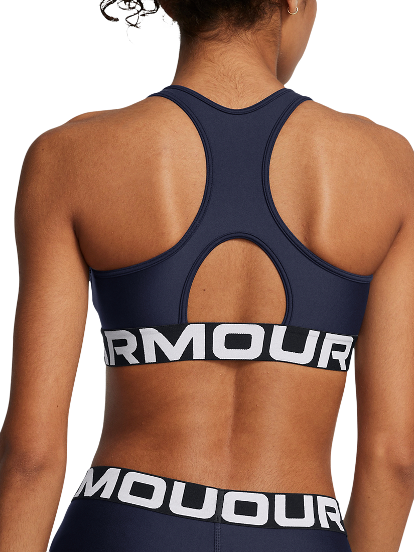 Product image 2 of 11, which shows Under Armour Logo Medium Impact Padded Sports Bra, Navy / White, XS