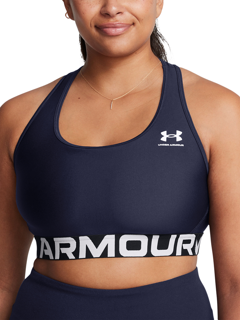 Product image 6 of 11, which shows Under Armour Logo Medium Impact Padded Sports Bra, Navy / White, XS