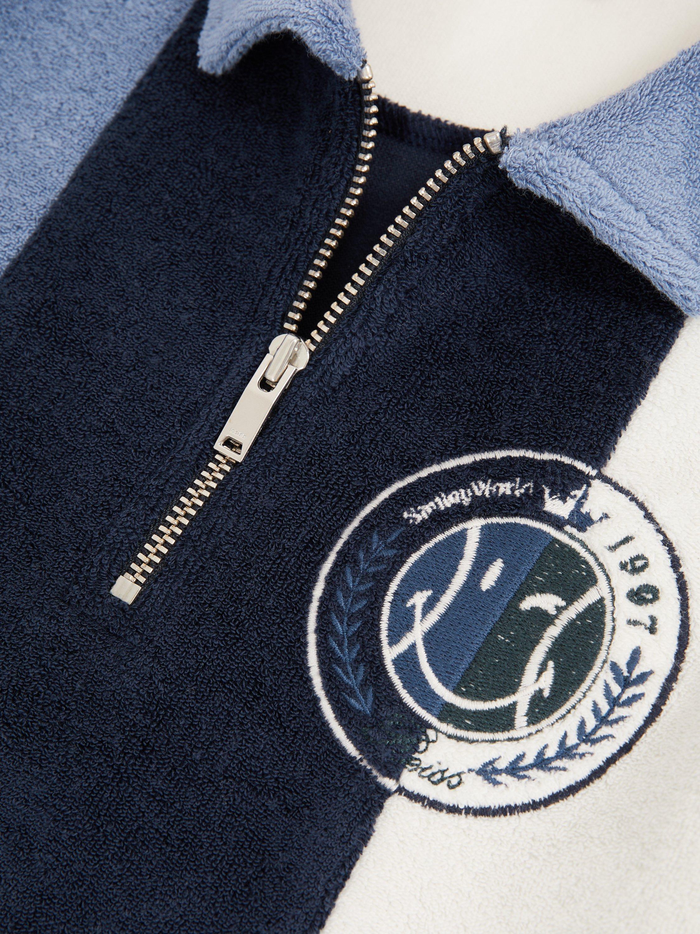 Product image 2 of 5, which shows Reiss Kids' Smiley Arthur Cotton Blend Zip Polo Shirt, Blue, 3-4 years