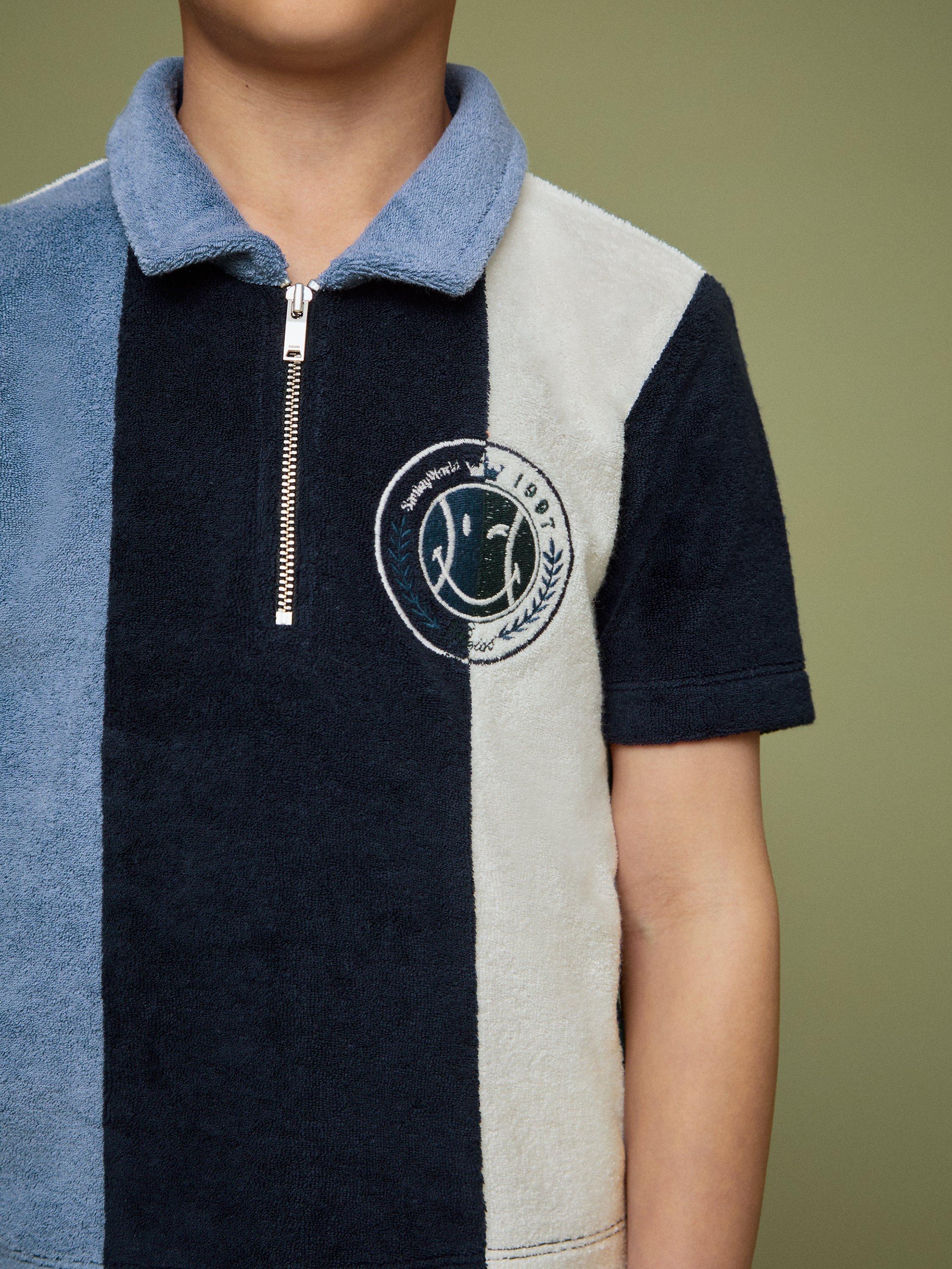 Product image 5 of 5, which shows Reiss Kids' Smiley Arthur Cotton Blend Zip Polo Shirt, Blue, 3-4 years