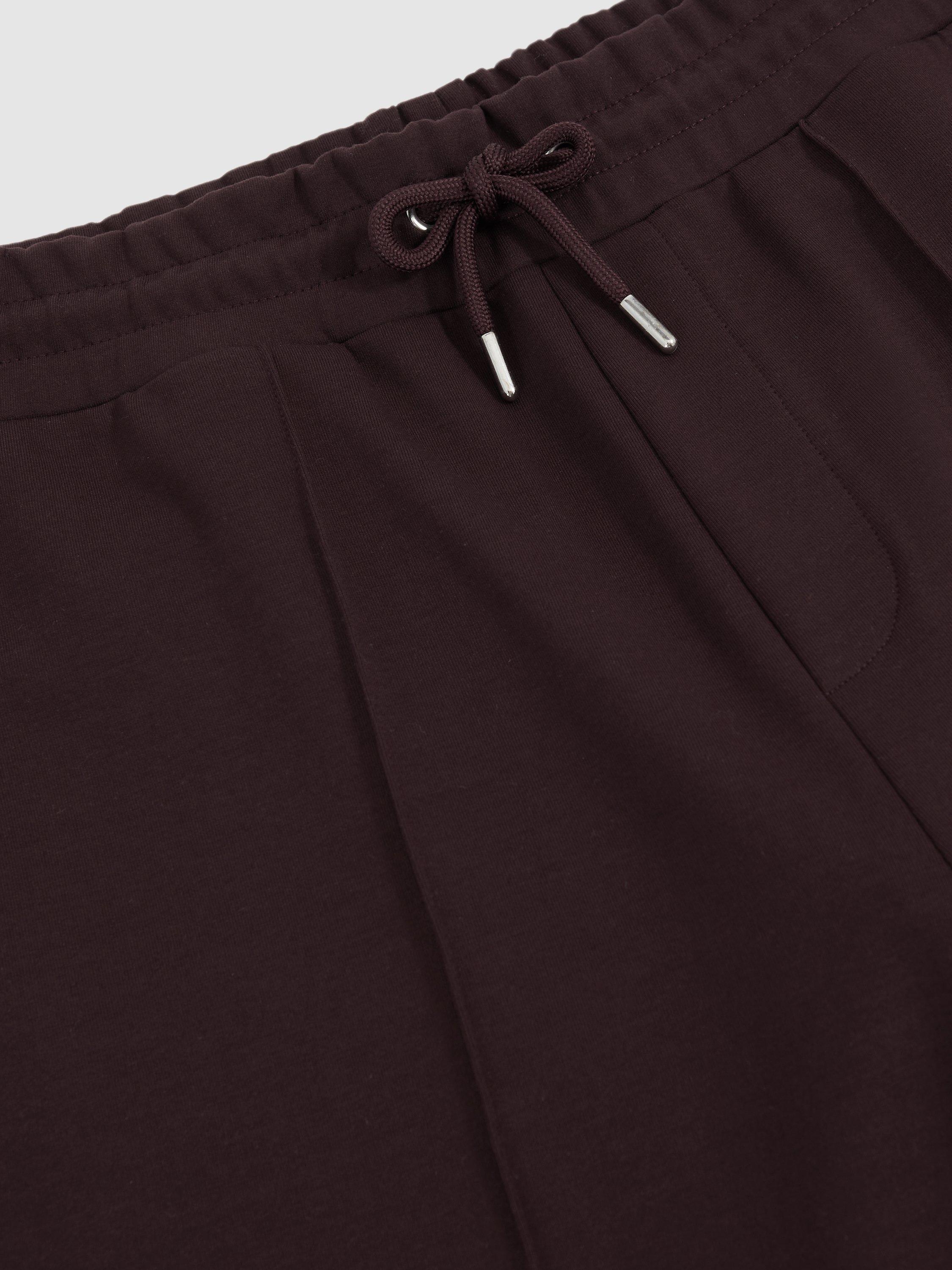 Product image 2 of 5, which shows Reiss Premier Interlock Drawstring Joggers, Cherry Red, XS
