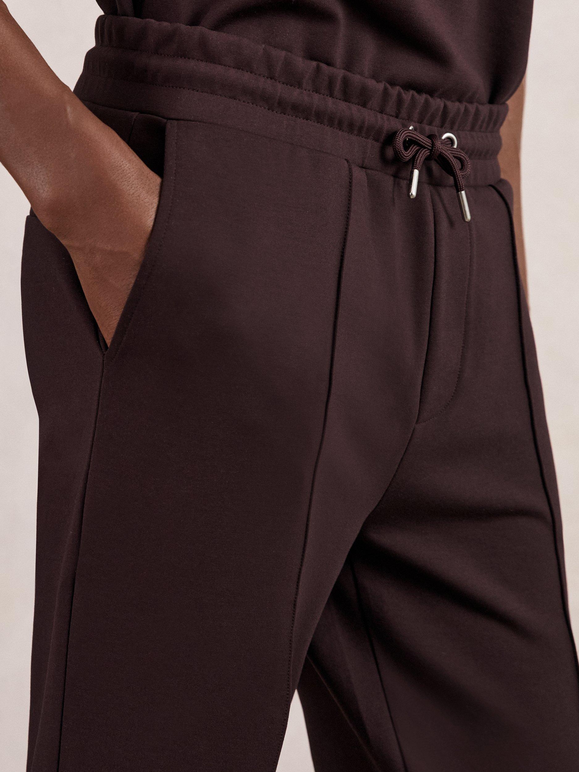 Product image 4 of 5, which shows Reiss Premier Interlock Drawstring Joggers, Cherry Red, XS
