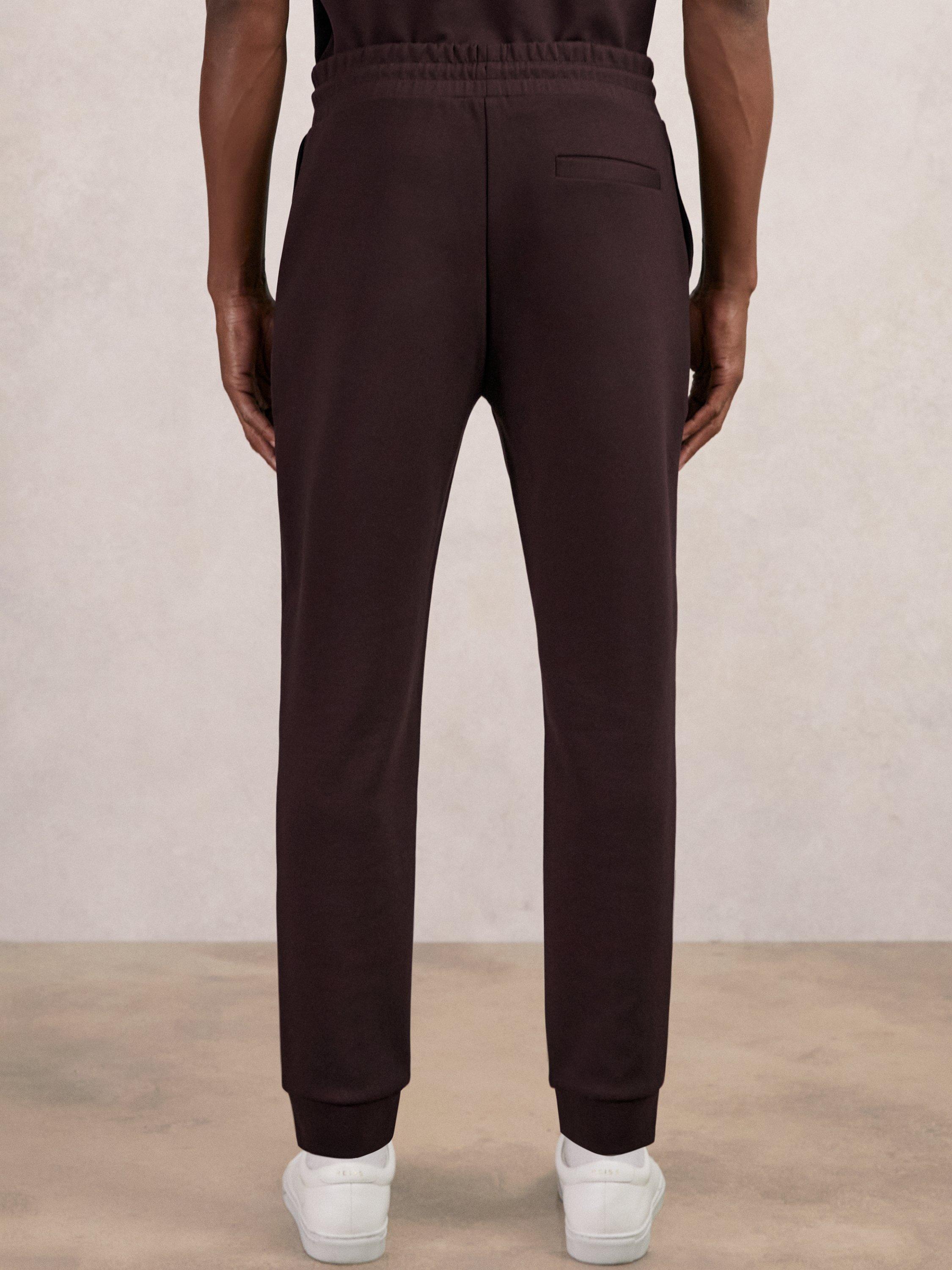Product image 5 of 5, which shows Reiss Premier Interlock Drawstring Joggers, Cherry Red, XS