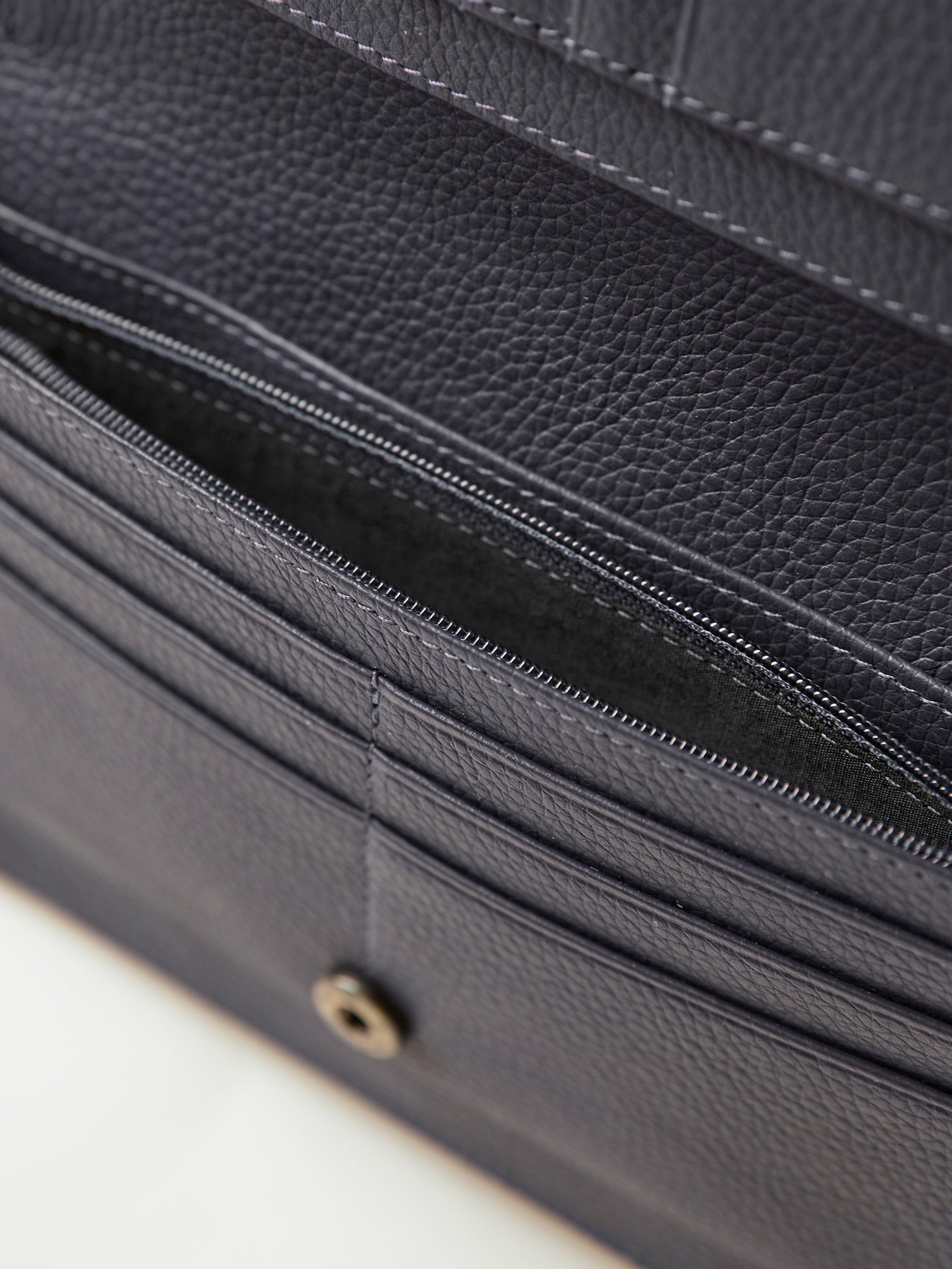 Product image 4 of 5, which shows Celtic & Co. Leather Cross Body Adjustable Strap Phone Bag, Ink Well, Blue