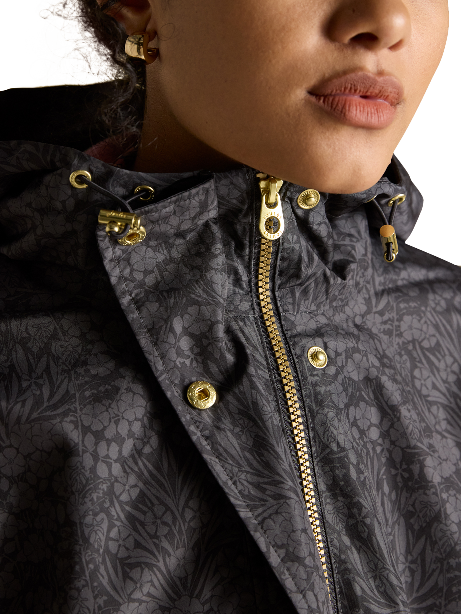 Product image 2 of 8, which shows Joules Holkham Floral Waterproof Packable Raincoat, Black, 6