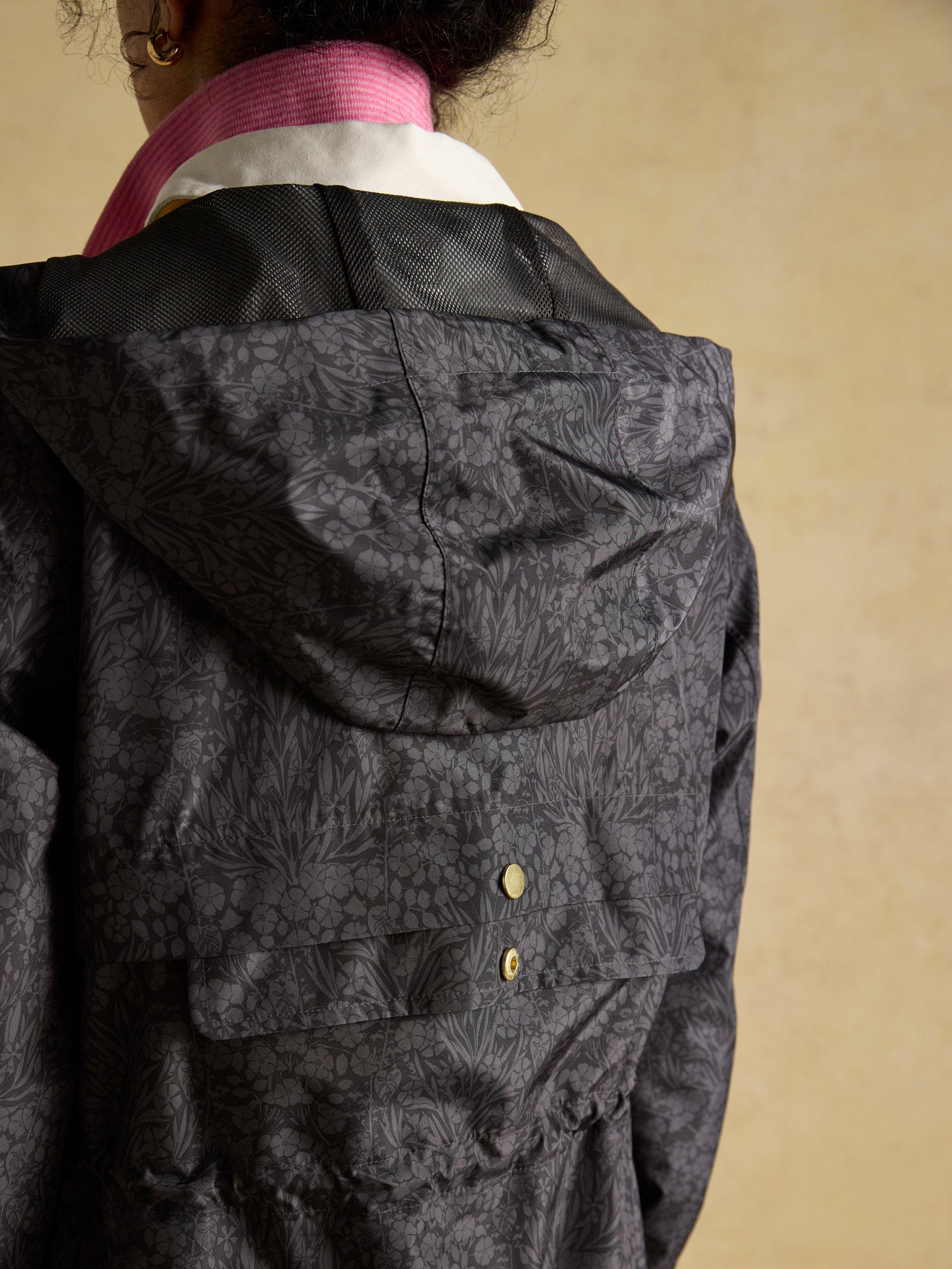 Product image 8 of 8, which shows Joules Holkham Floral Waterproof Packable Raincoat, Black, 6