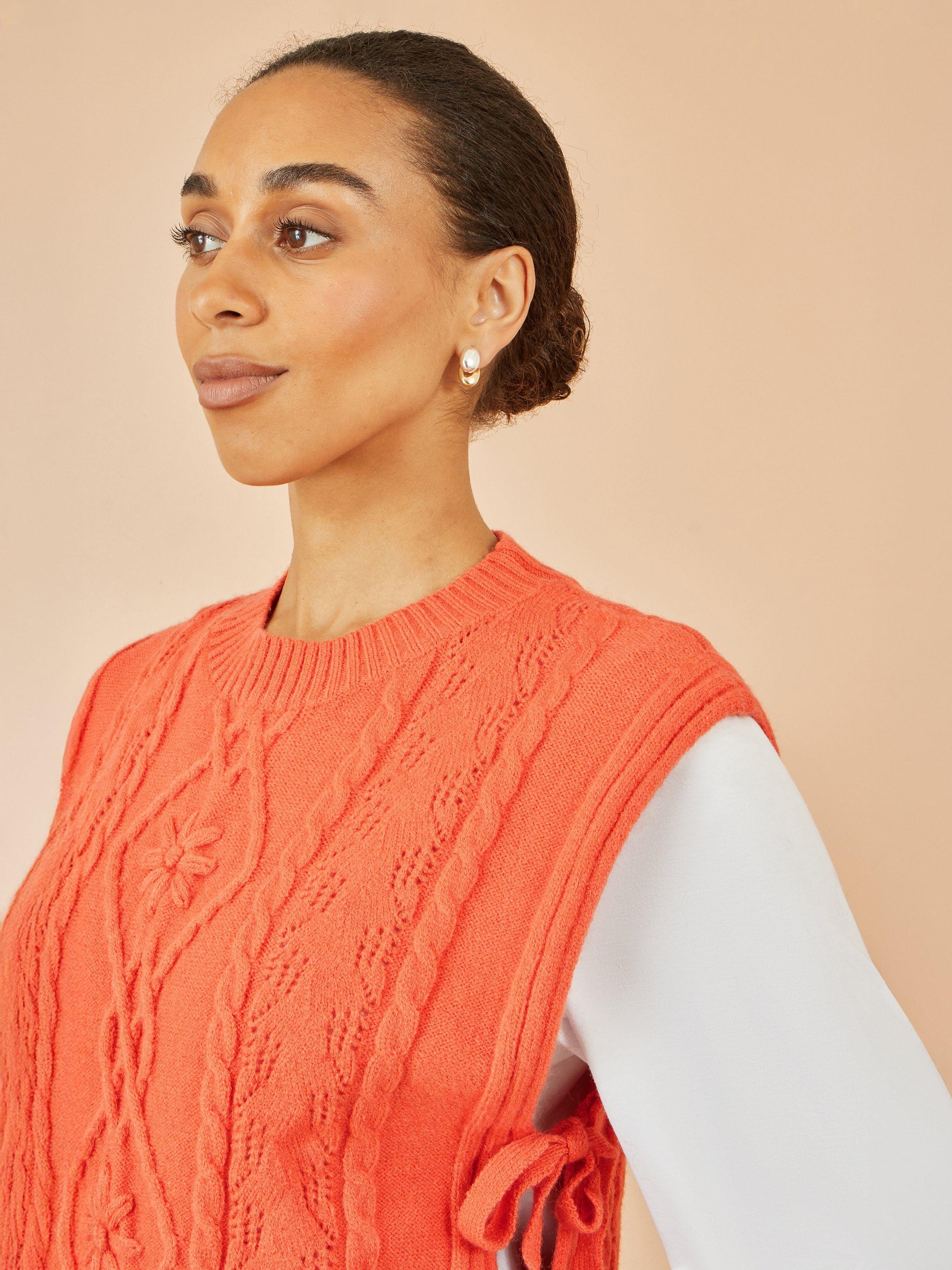 Product image 3 of 5, which shows Yumi Flower Print Cable Knit Tie Side Pullover, Orange, S