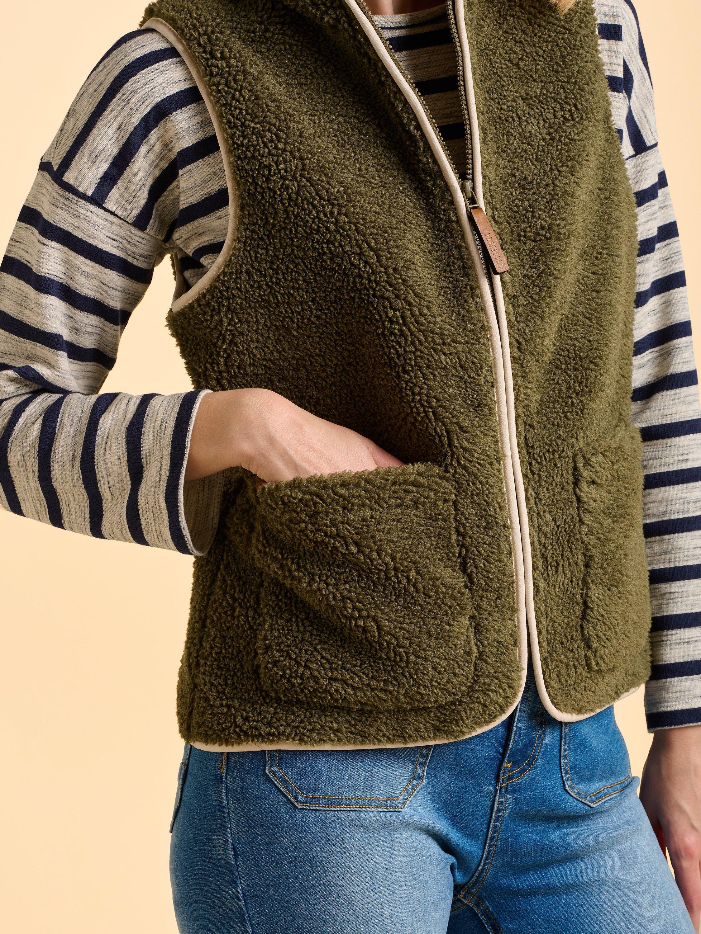 Product image 4 of 6, which shows Brakeburn Snug High Neck Zip Gilet, Green, 8