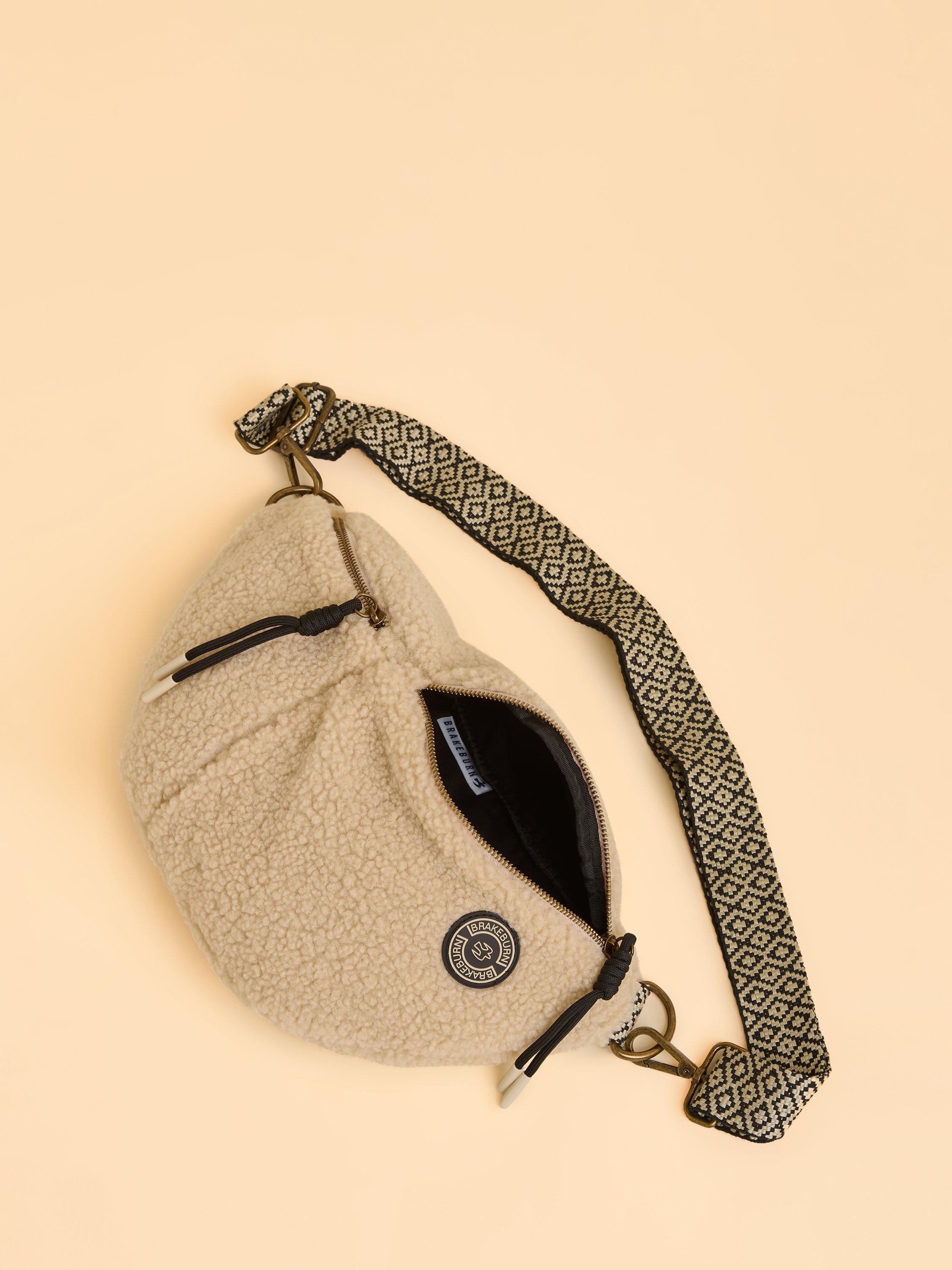 Product image 2 of 4, which shows Brakeburn Ope Teddy Fleece Sling Bag, Cream