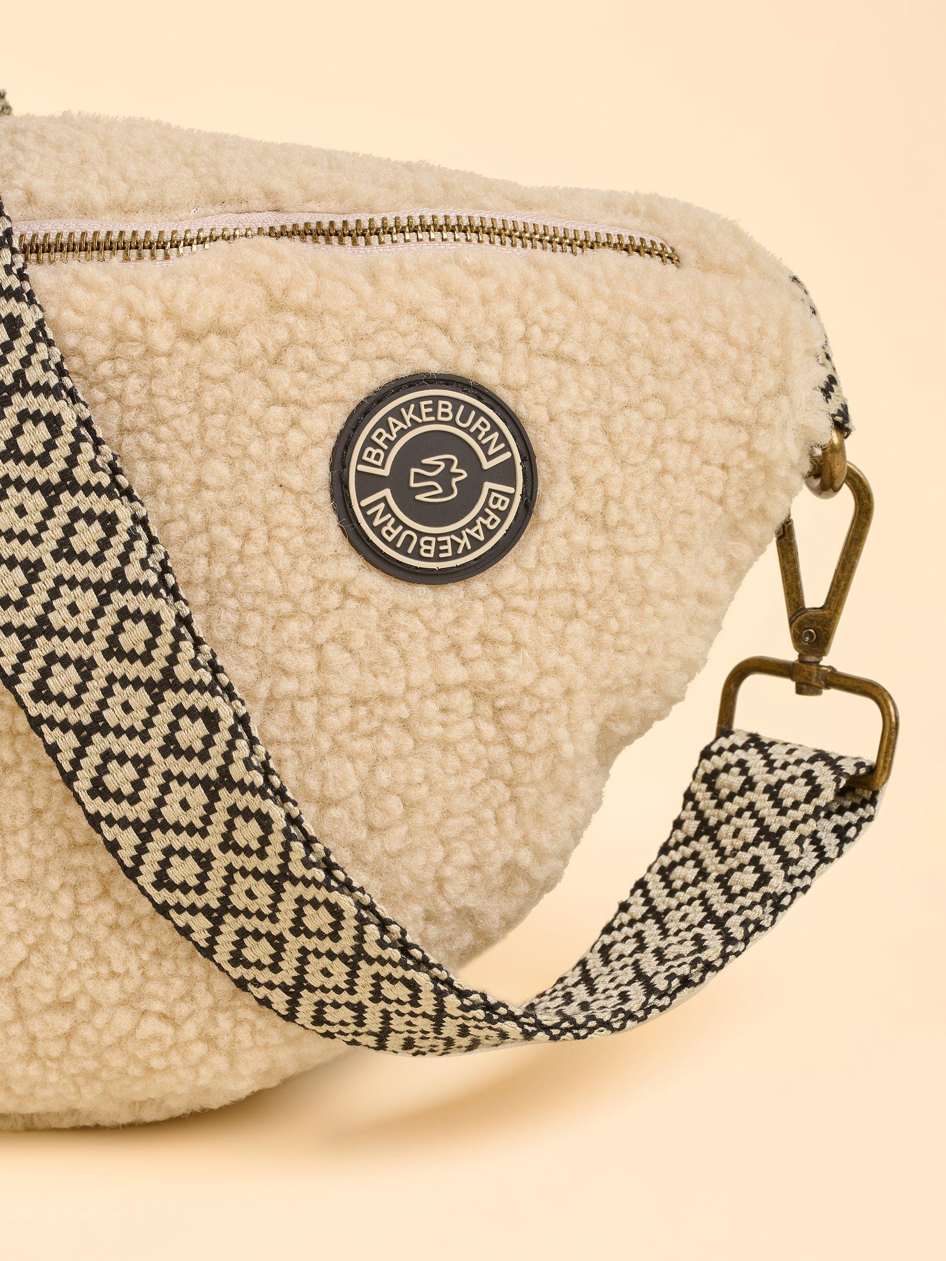 Product image 3 of 4, which shows Brakeburn Ope Teddy Fleece Sling Bag, Cream