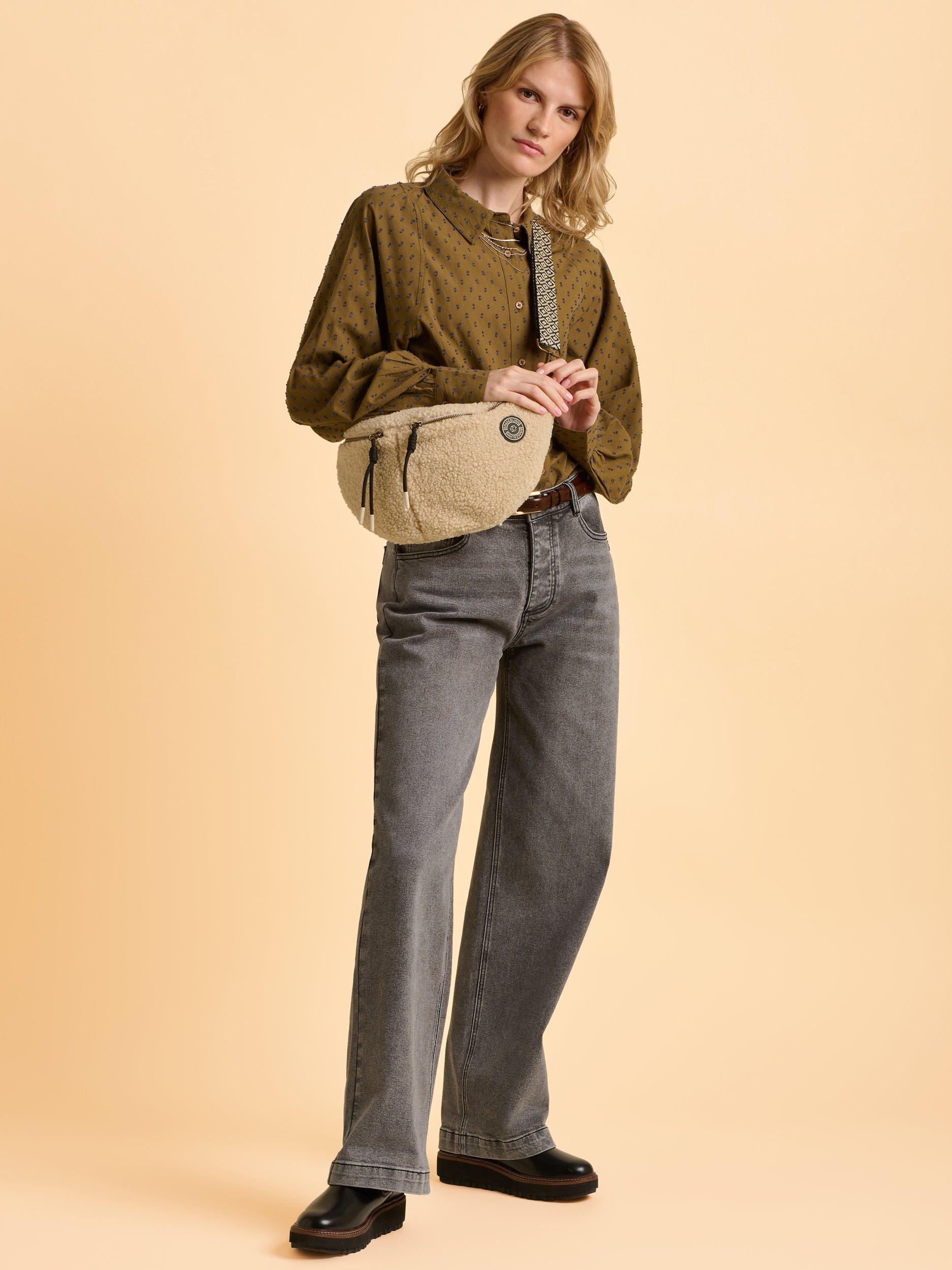 Product image 4 of 4, which shows Brakeburn Ope Teddy Fleece Sling Bag, Cream