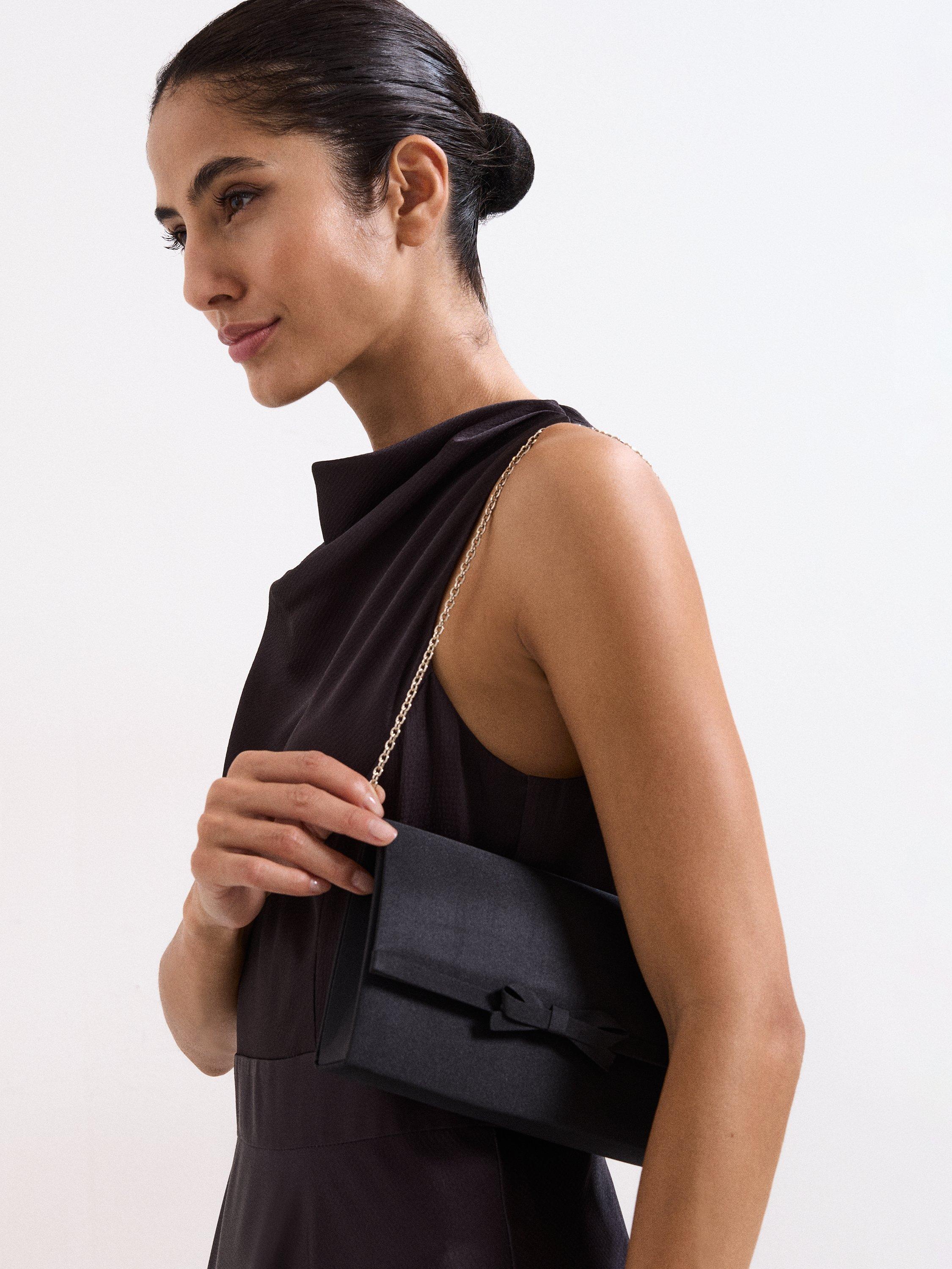 Product image 6 of 8, which shows Phase Eight Grosgrain Bow Clutch Bag, Black, One Size