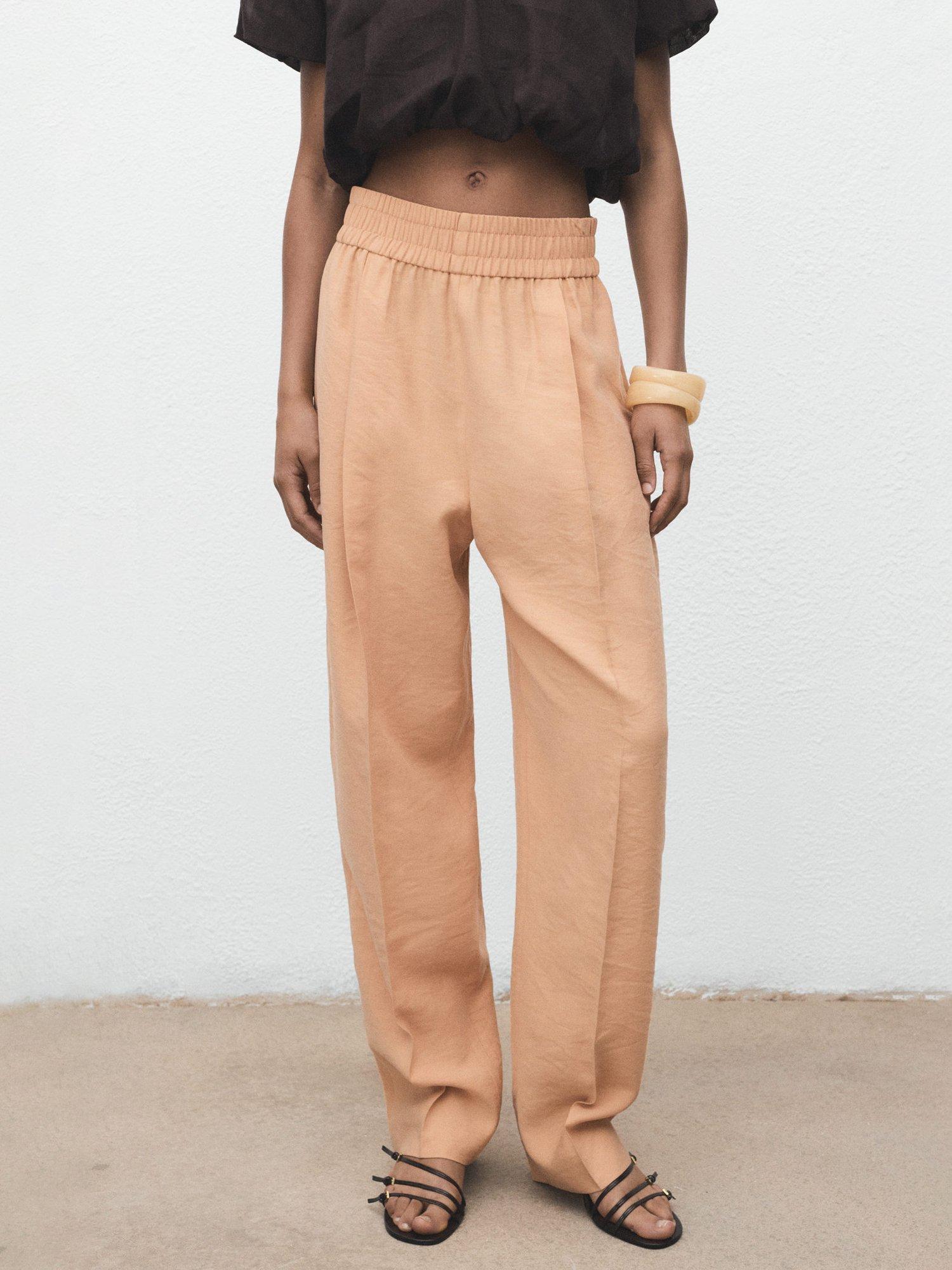 Product image 1 of 7, which shows Mango Cristy Tailored Trousers, Pastel Pink, L