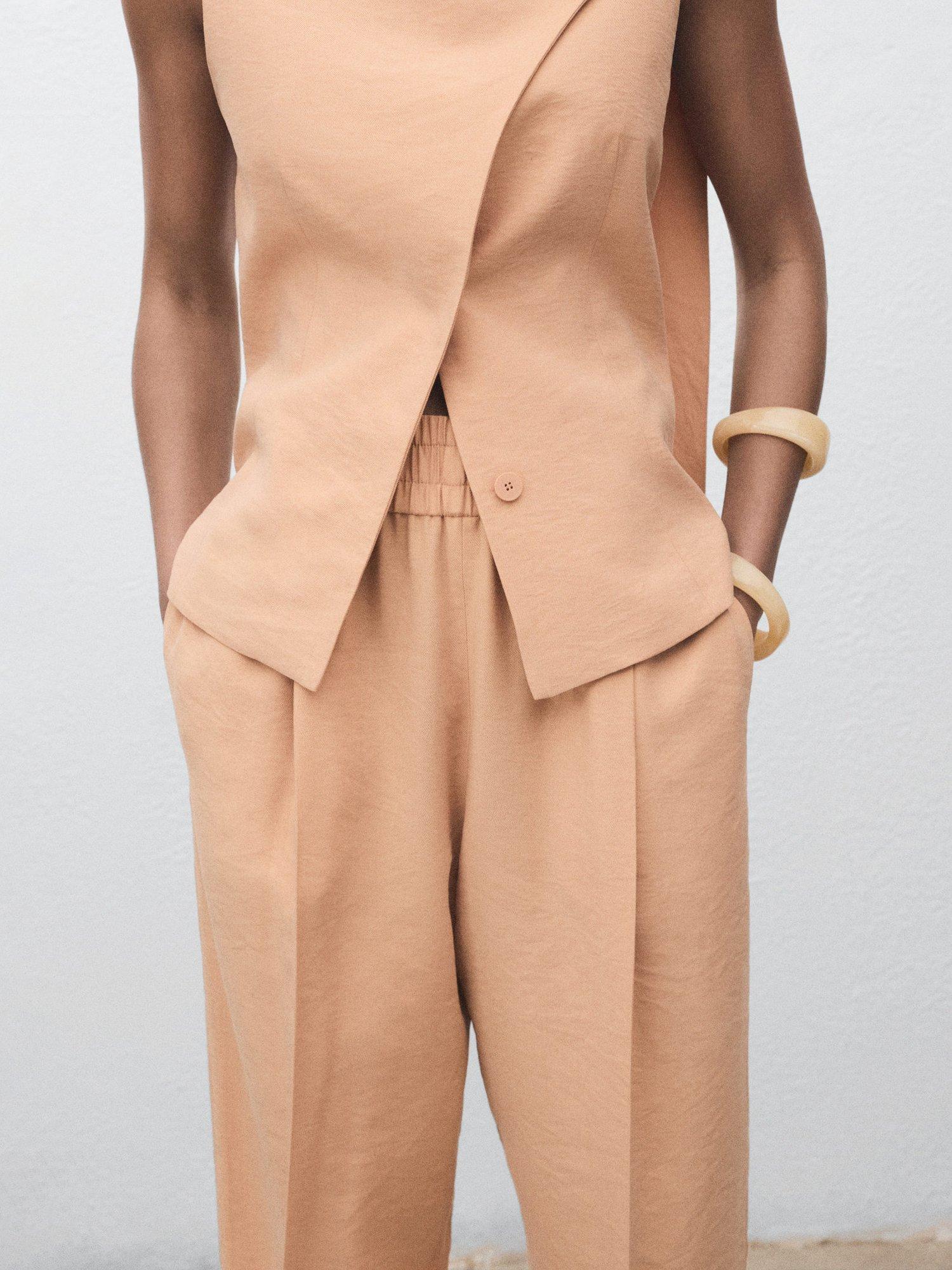 Product image 6 of 7, which shows Mango Cristy Tailored Trousers, Pastel Pink, L