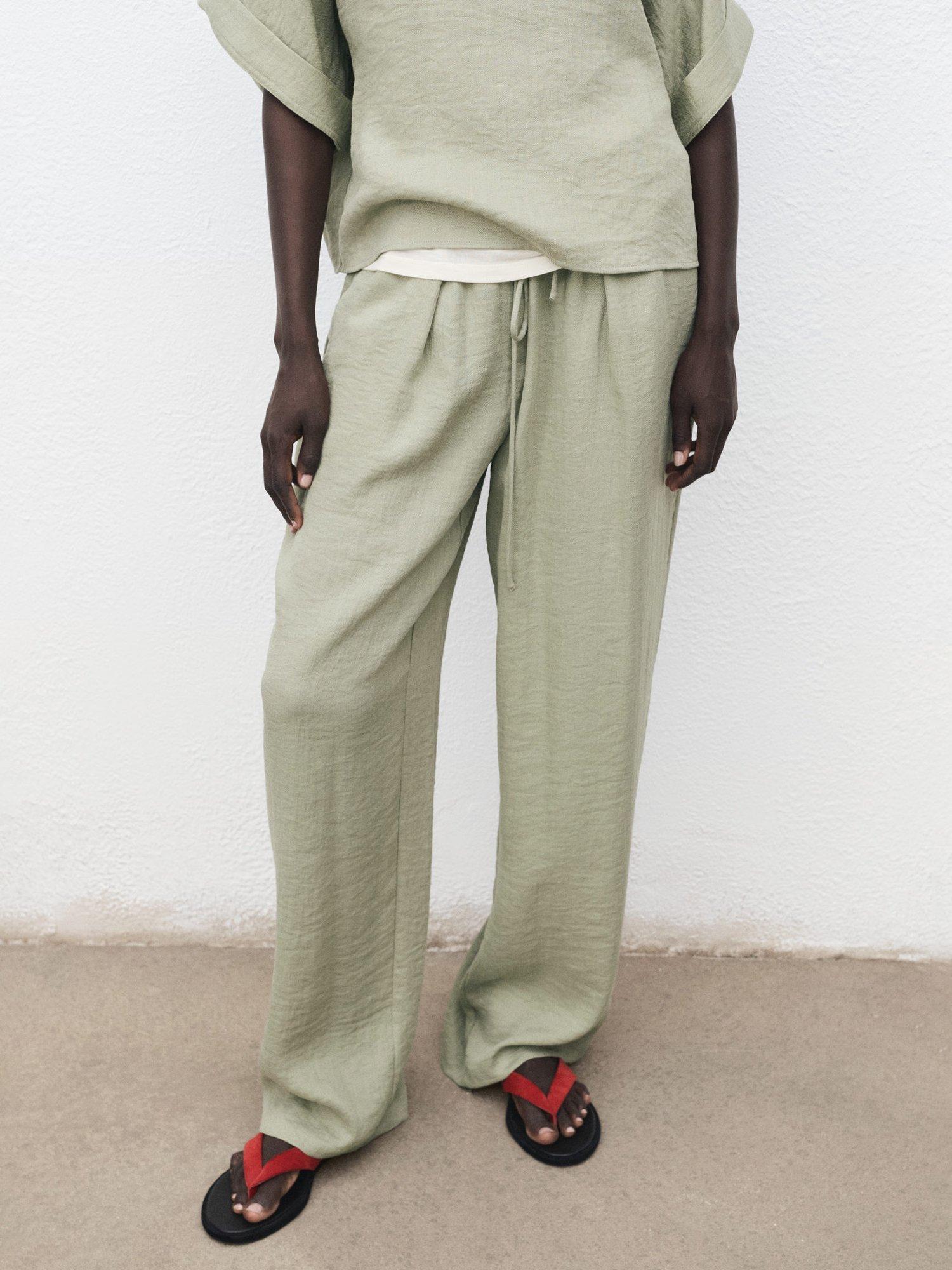 Product image 1 of 8, which shows Mango Salvia Tie Waist Trousers, Aqua, L