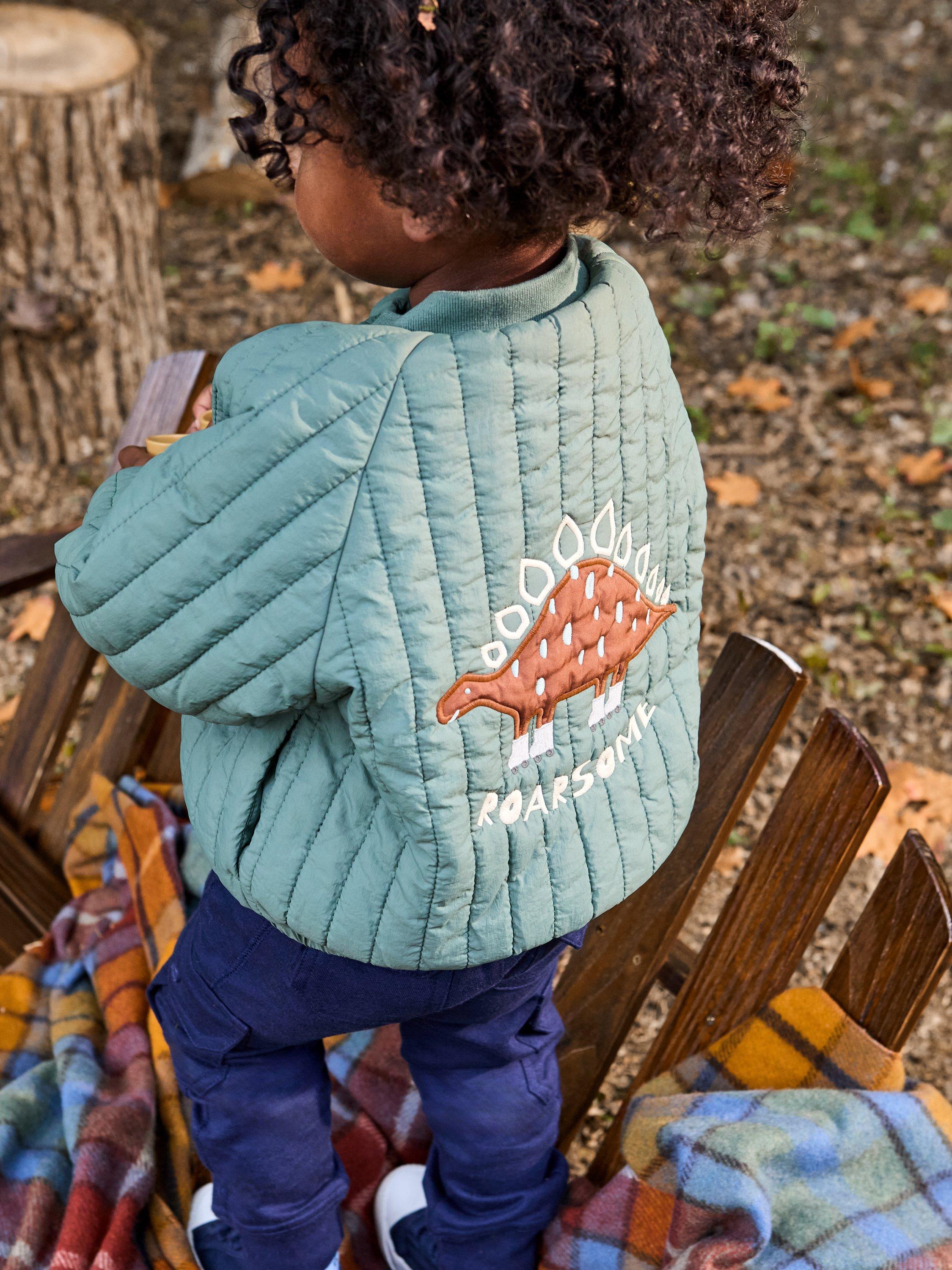 Product image 2 of 5, which shows JoJo Maman Bébé Kids' Quilted Dino Bomber Jacket, Khaki, 6-12 months