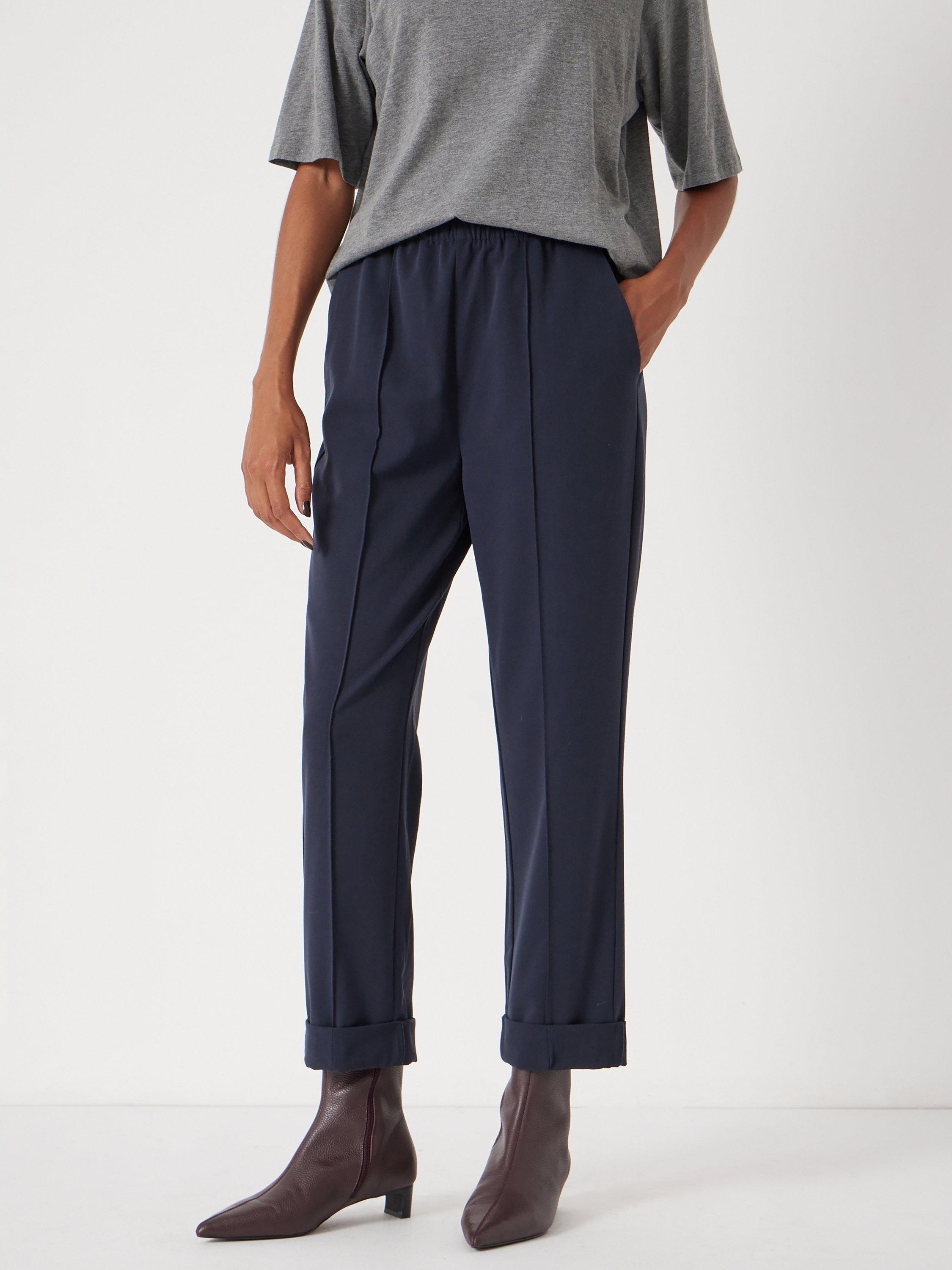 Product image 1 of 4, which shows HUSH Pull On Slim Fit Tailored Trousers, Navy, 6S