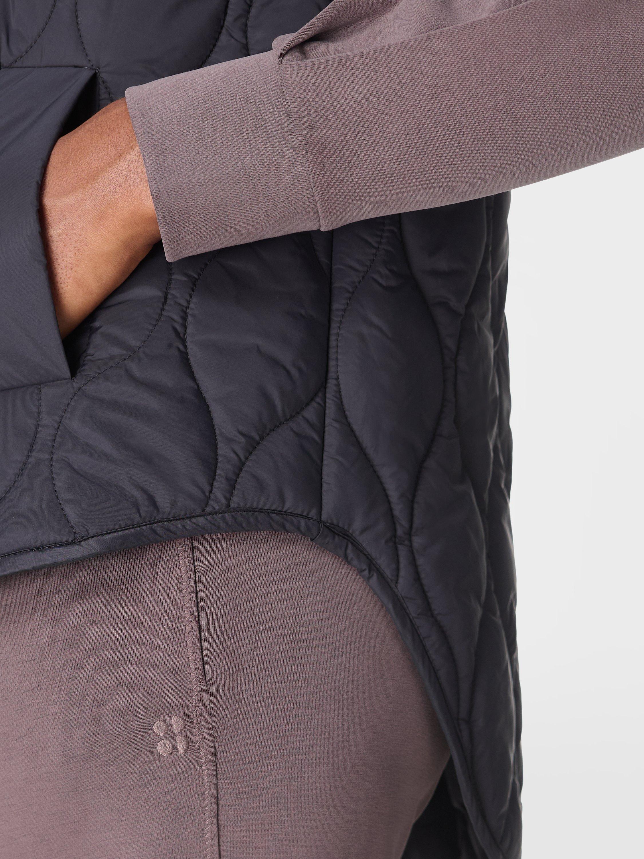 Product image 6 of 8, which shows Sweaty Betty Lightweight Quilted Gilet, Black, XXS
