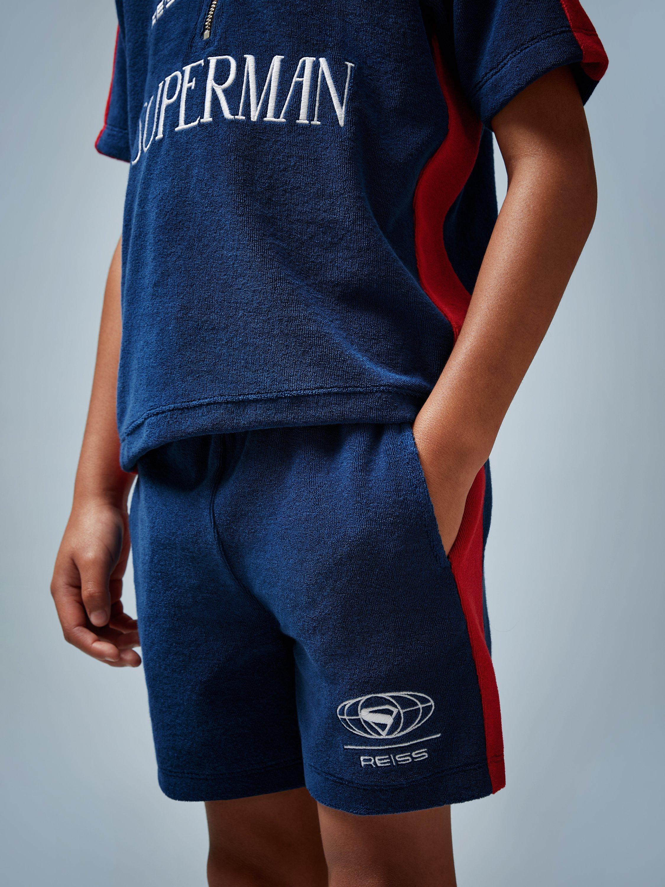 Product image 1 of 4, which shows Reiss Kids' Krypto Cotton Blend Drawstring Shorts, Blue/Red, 3-4 years