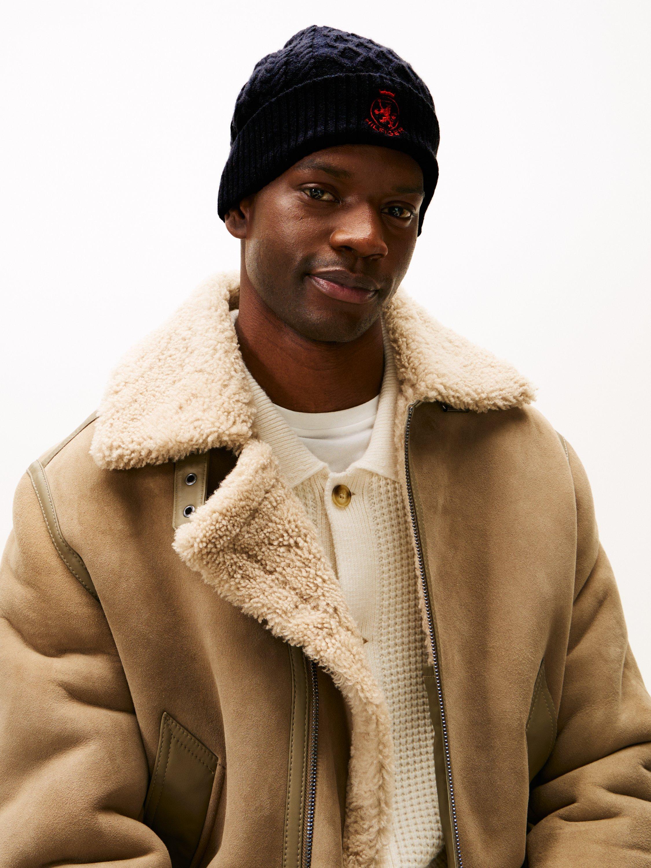 Product image 4 of 4, which shows Tommy Hilfiger Wool Blend Crest Cable Knit Beanie, Space Blue/Red, One Size