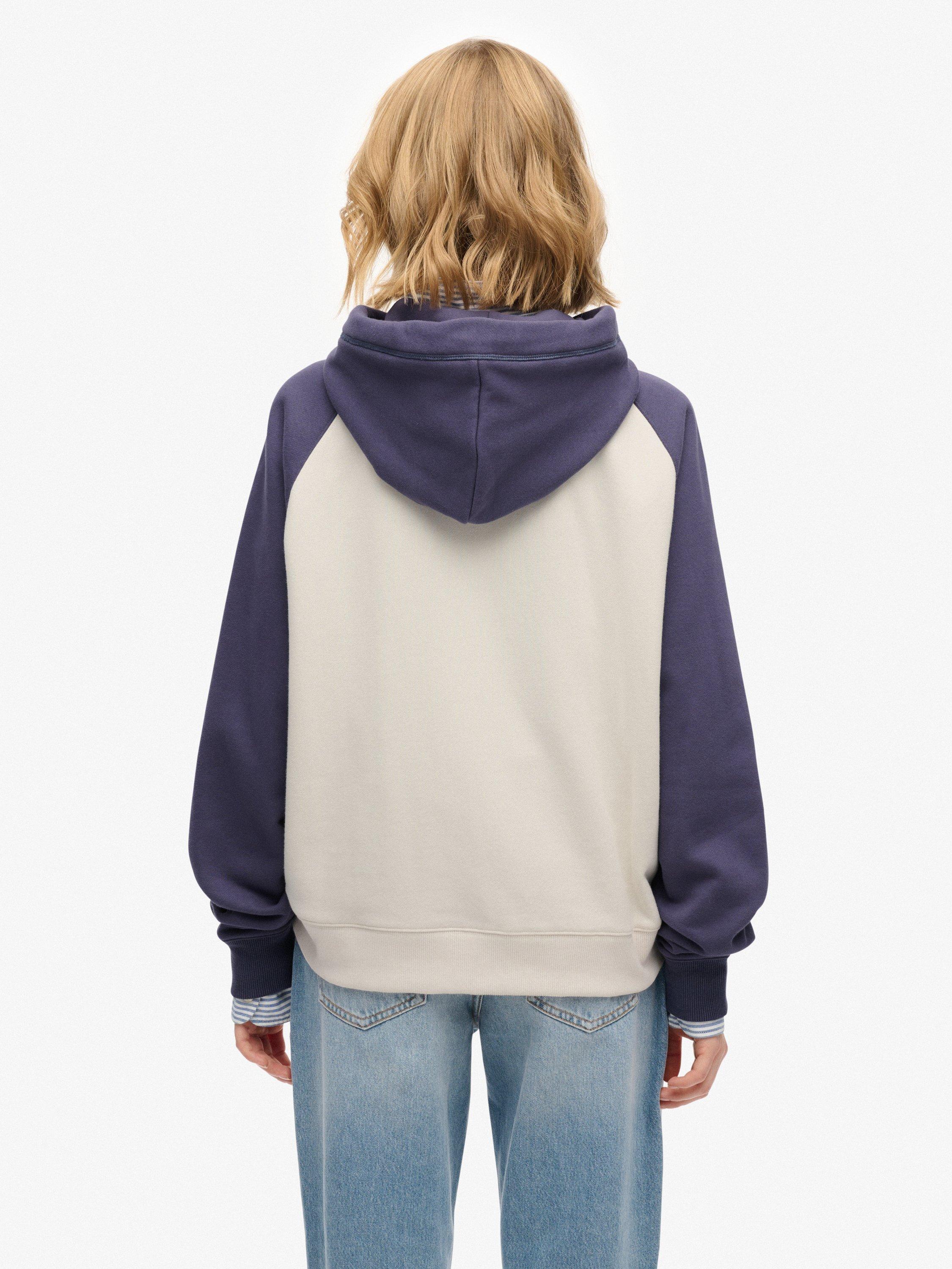 Product image 2 of 5, which shows Superdry Essential Logo Raglan Zip Hoodie, Desert Bone/Navy, 12