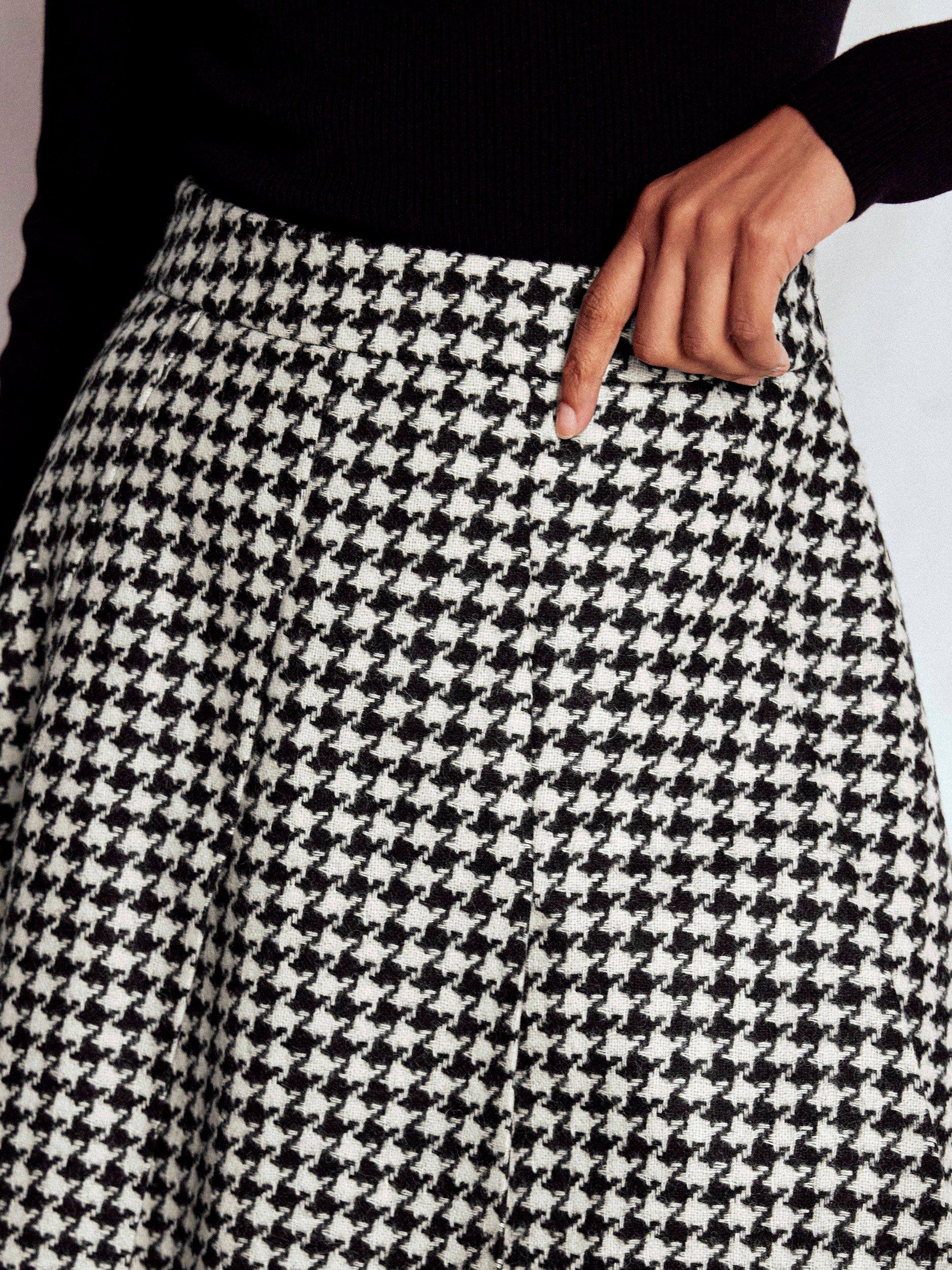 Product image 2 of 5, which shows Boden Houndstooth Pure Wool Flippy Skirt, Black/Multi, 8