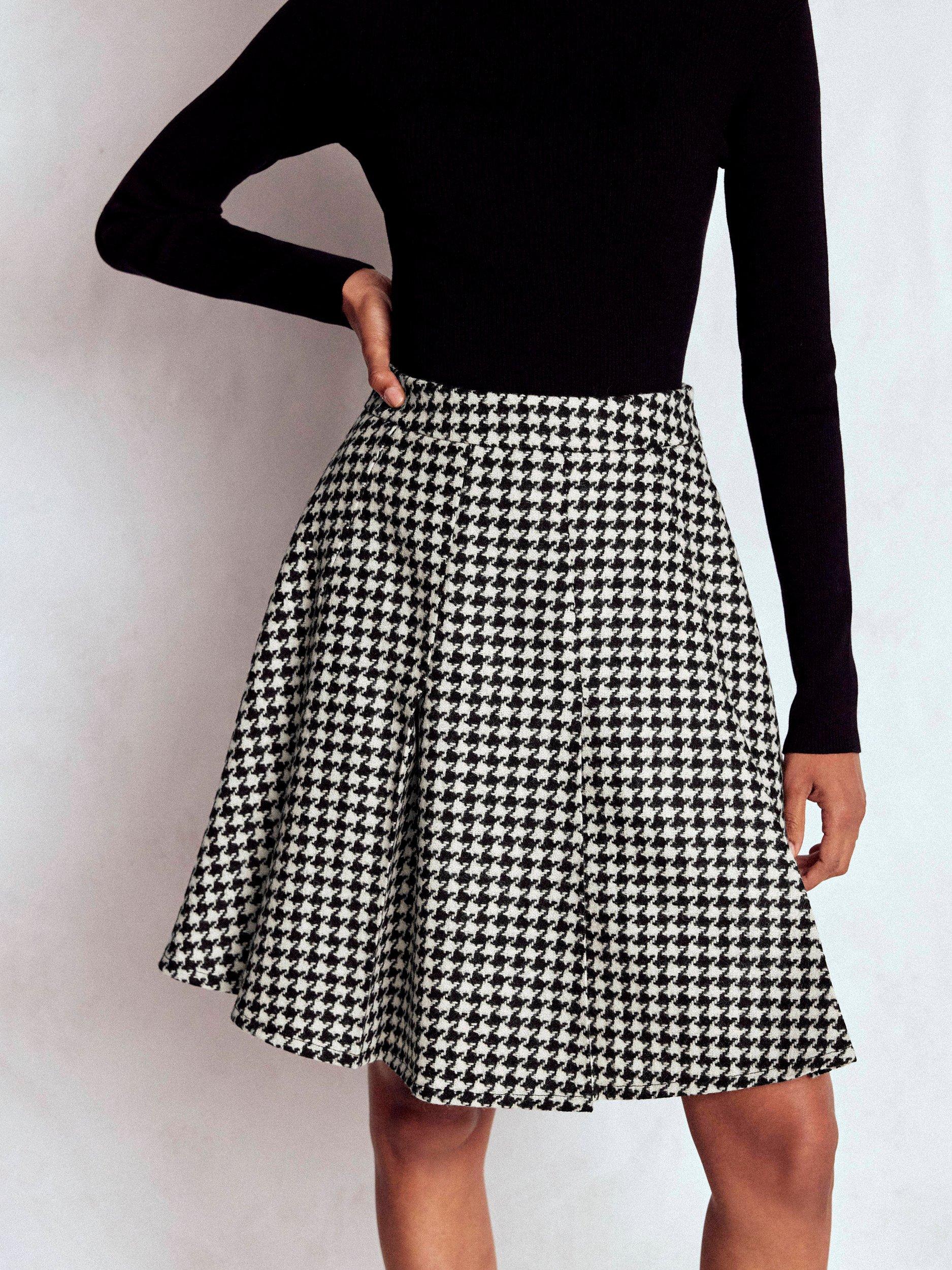 Product image 4 of 5, which shows Boden Houndstooth Pure Wool Flippy Skirt, Black/Multi, 8
