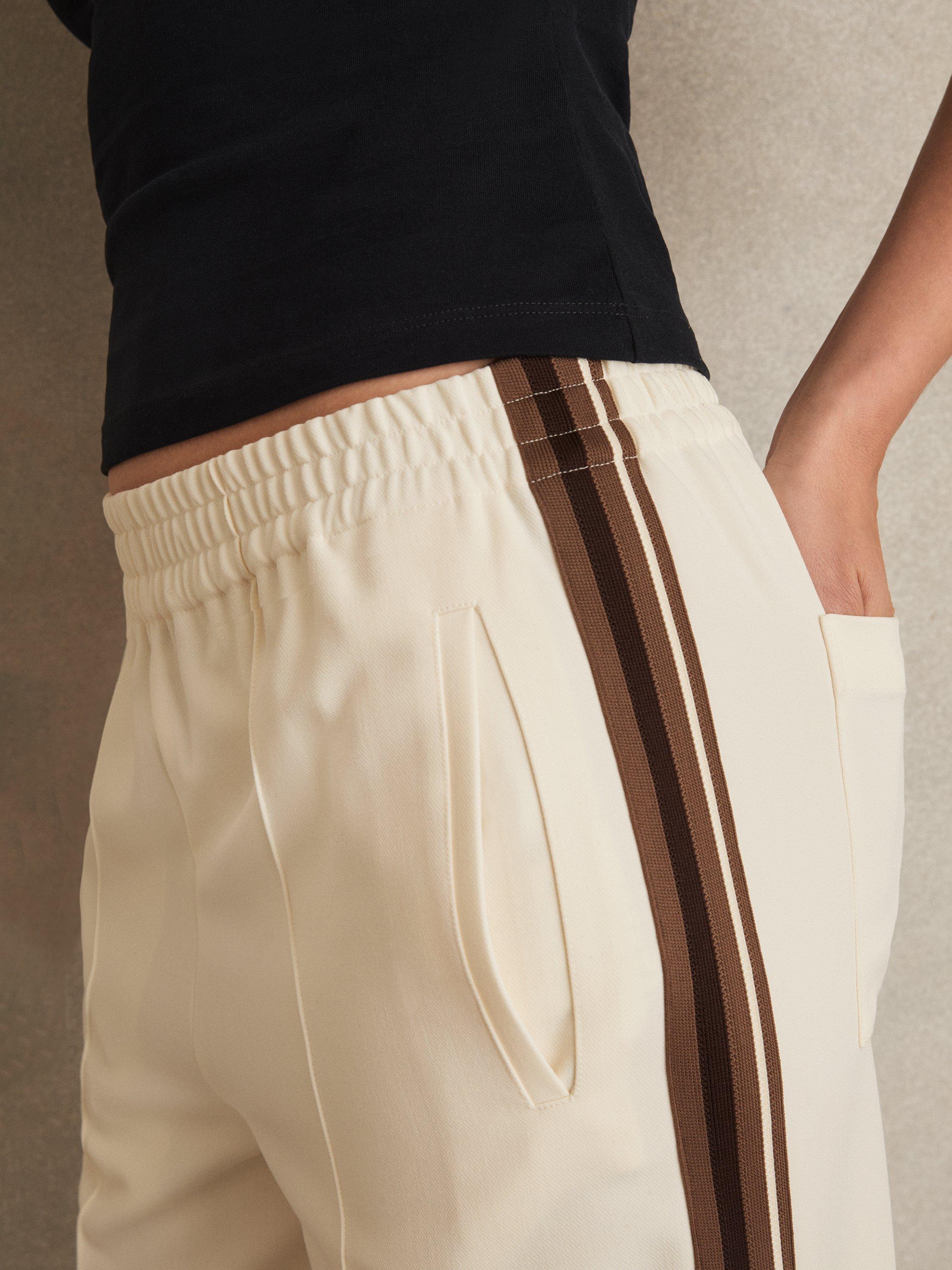 Product image 4 of 5, which shows Reiss Robyn Side Stripe Wide Leg Trousers, Cream, 10 R