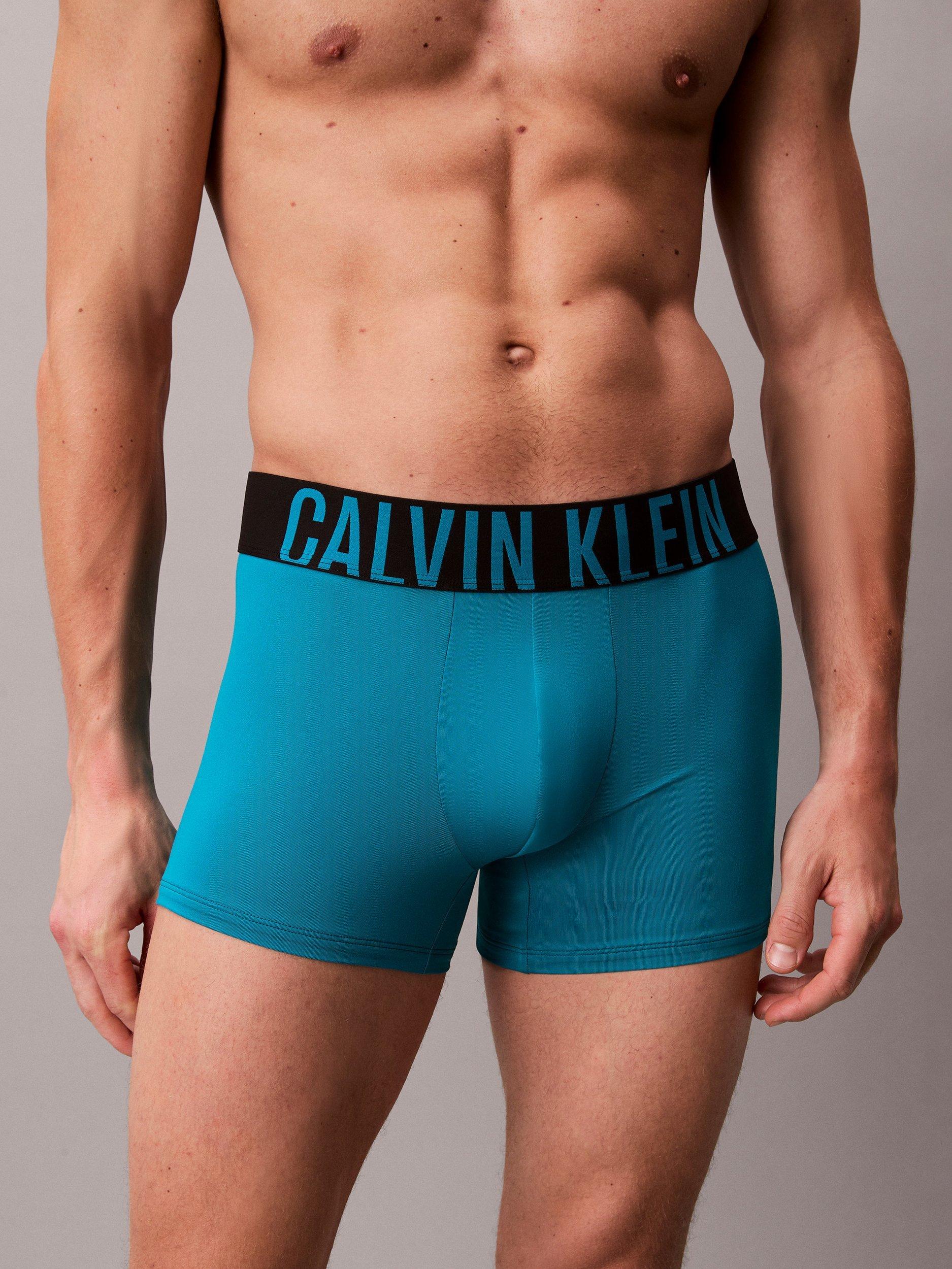 Product image 4 of 6, which shows Calvin Klein Intense Power Micro Trunks, Pack of 3, Black/Teal Breeze/Forest Freeze, XS