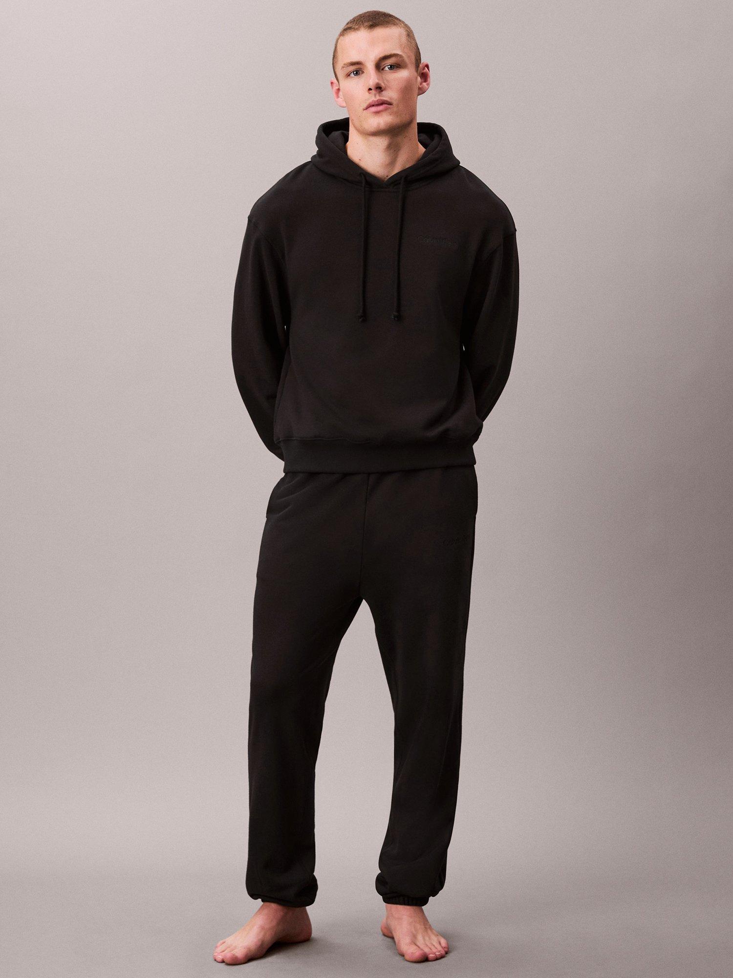 Product image 1 of 5, which shows Calvin Klein Cotton Terry Joggers, Black, S