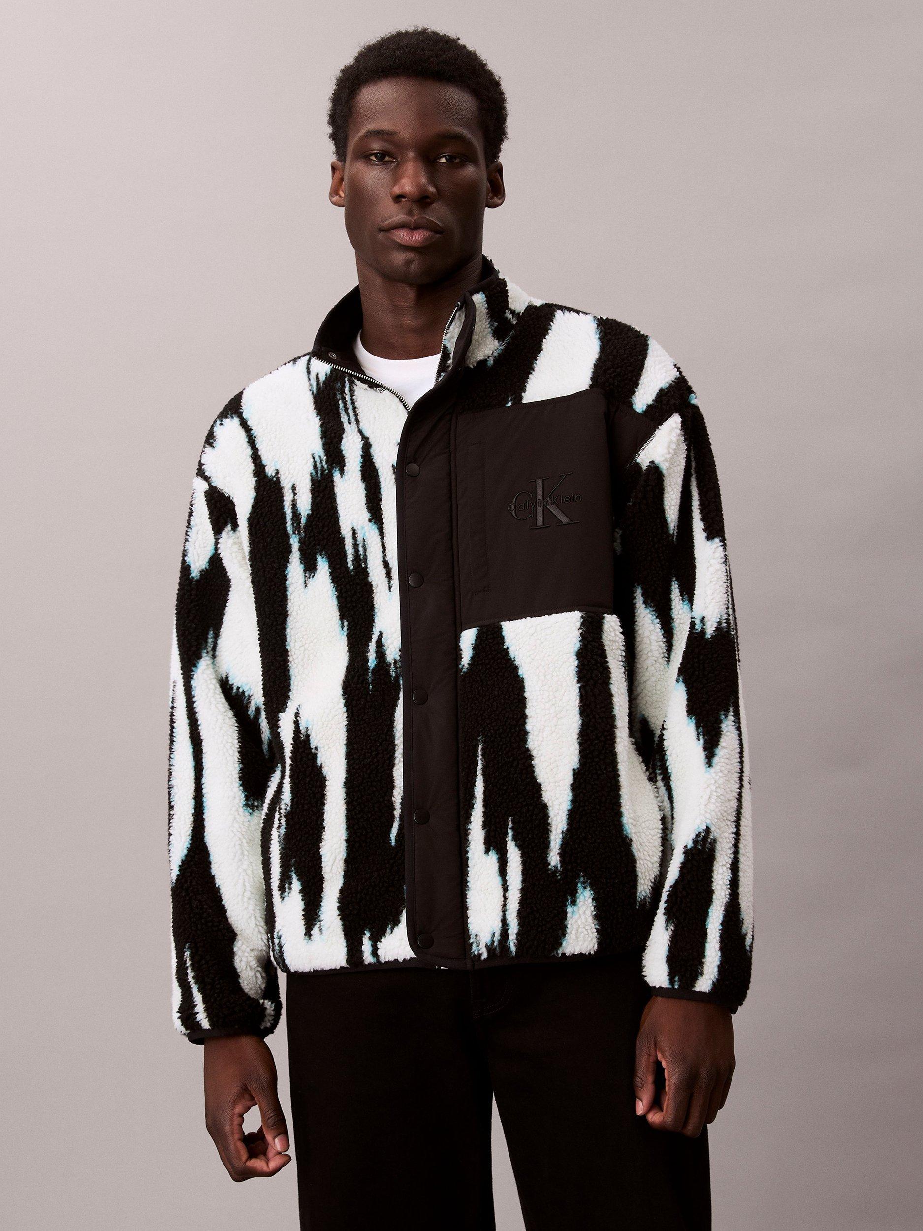 Product image 1 of 6, which shows Calvin Klein High Neck Printed Sherpa Jacket, Black, XS