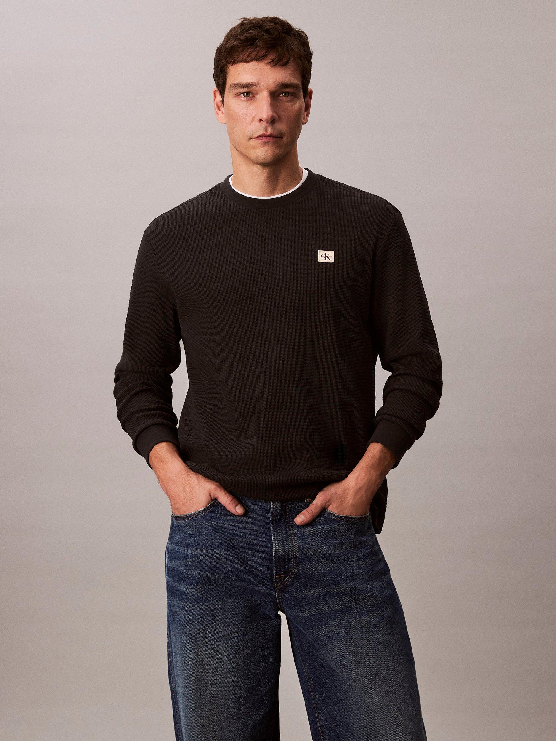 Product image 1 of 7, which shows Calvin Klein Badge Logo Crew Neck Top, Black, XS