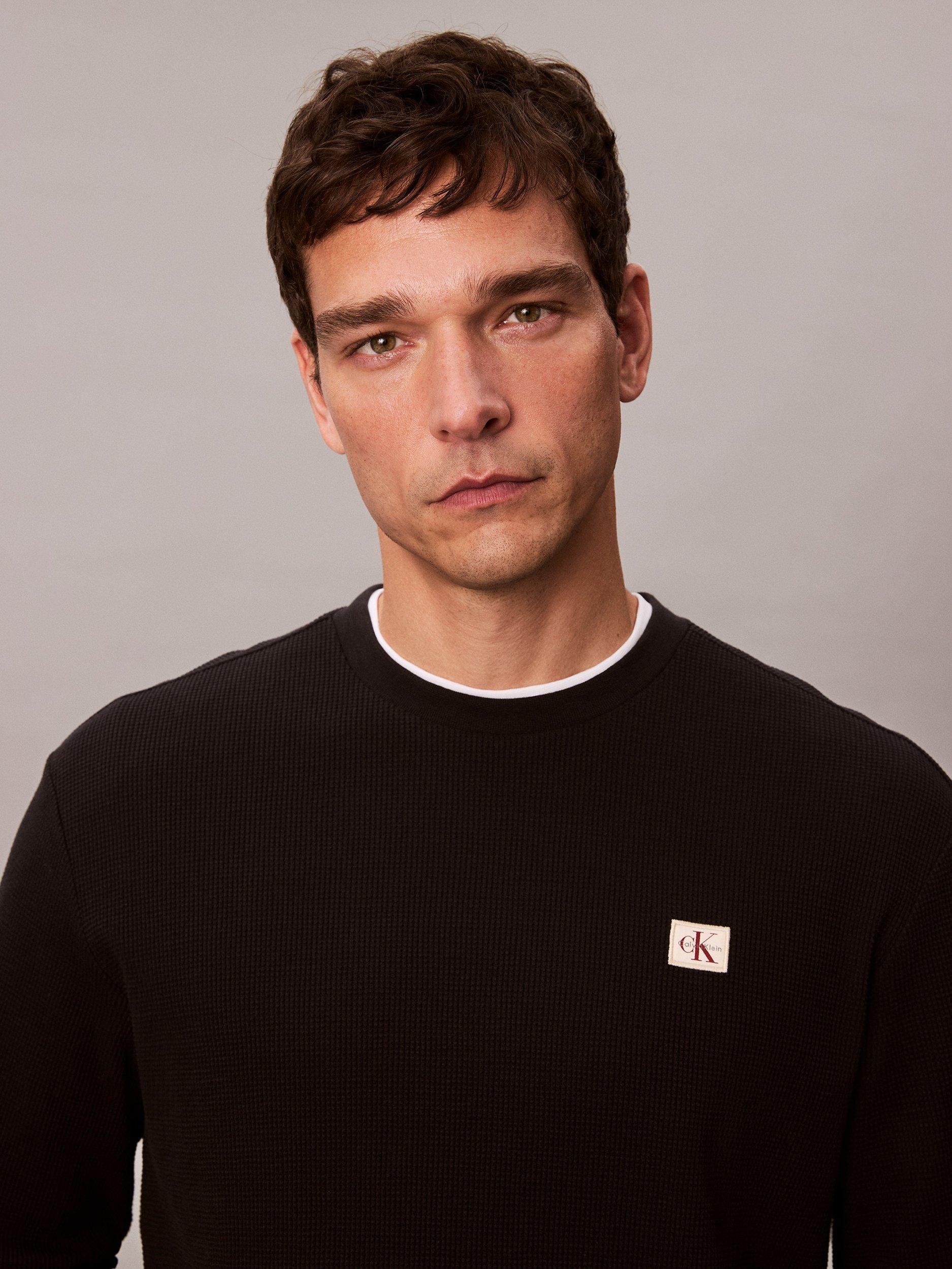 Product image 4 of 7, which shows Calvin Klein Badge Logo Crew Neck Top, Black, XS