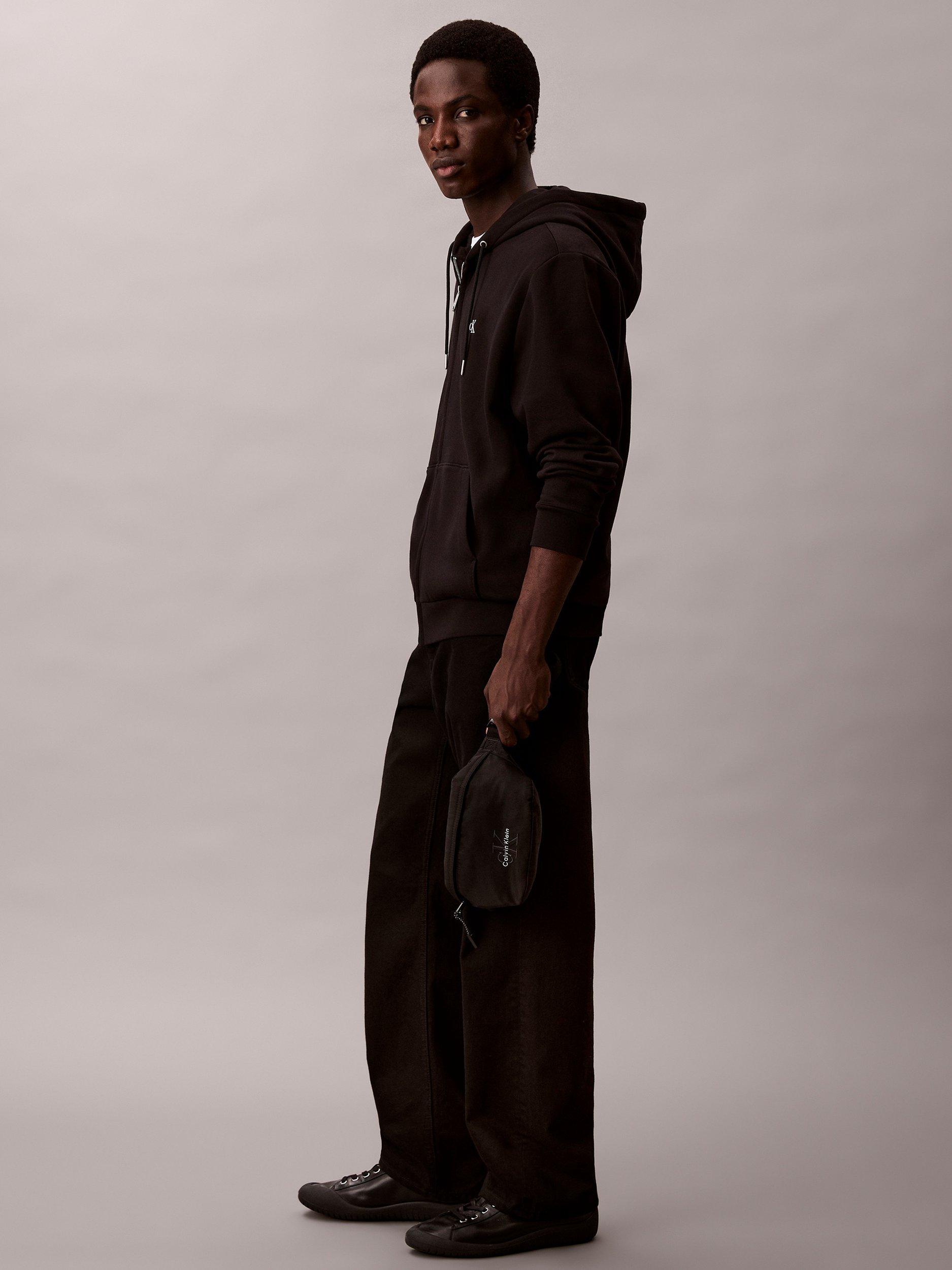 Product image 2 of 2, which shows Calvin Klein Monogram Logo Waist Bag, Black