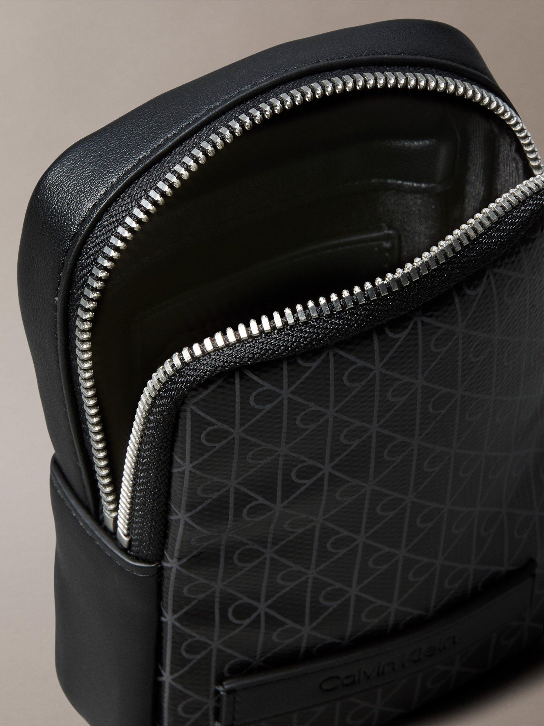 Product image 3 of 5, which shows Calvin Klein Monogram Logo Zip Pouch, Black, One Size