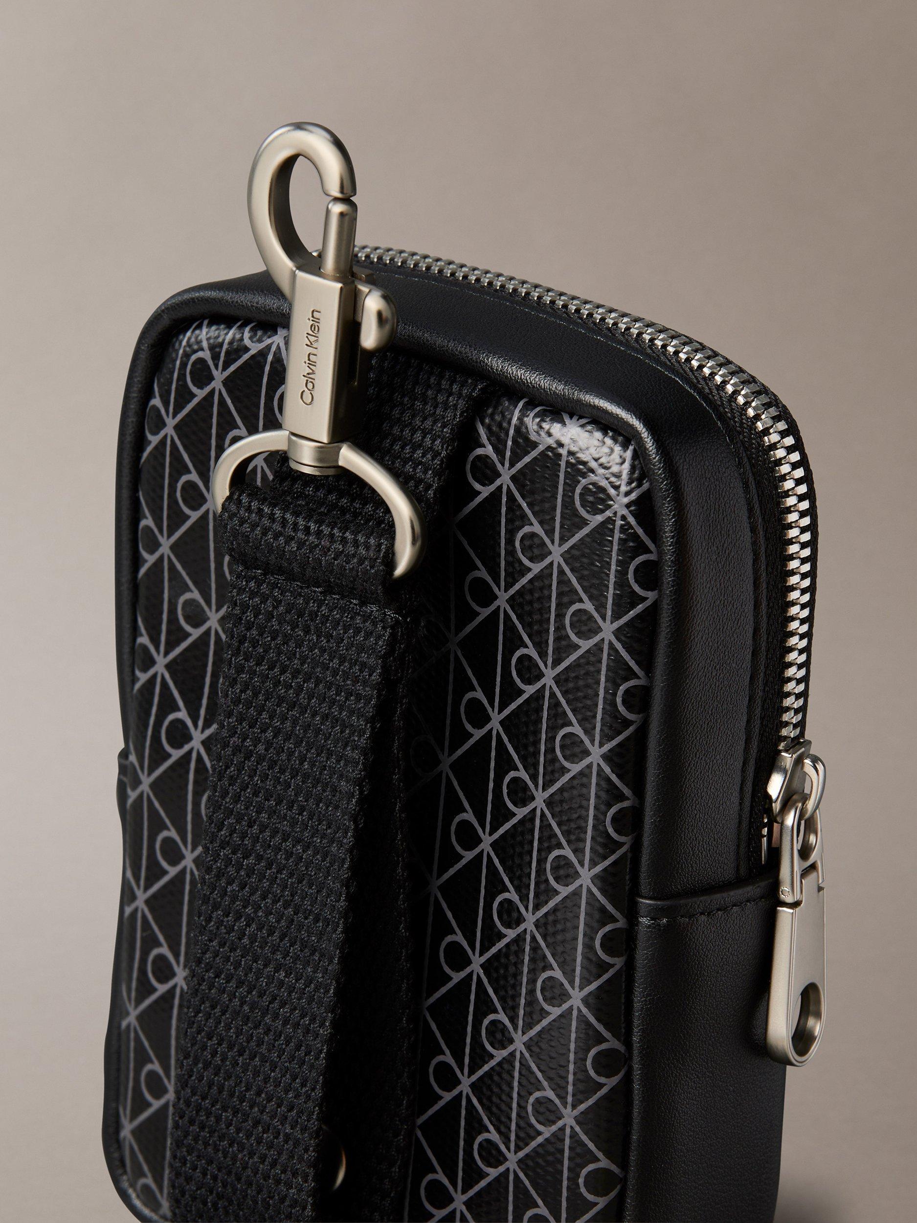 Product image 4 of 5, which shows Calvin Klein Monogram Logo Zip Pouch, Black, One Size