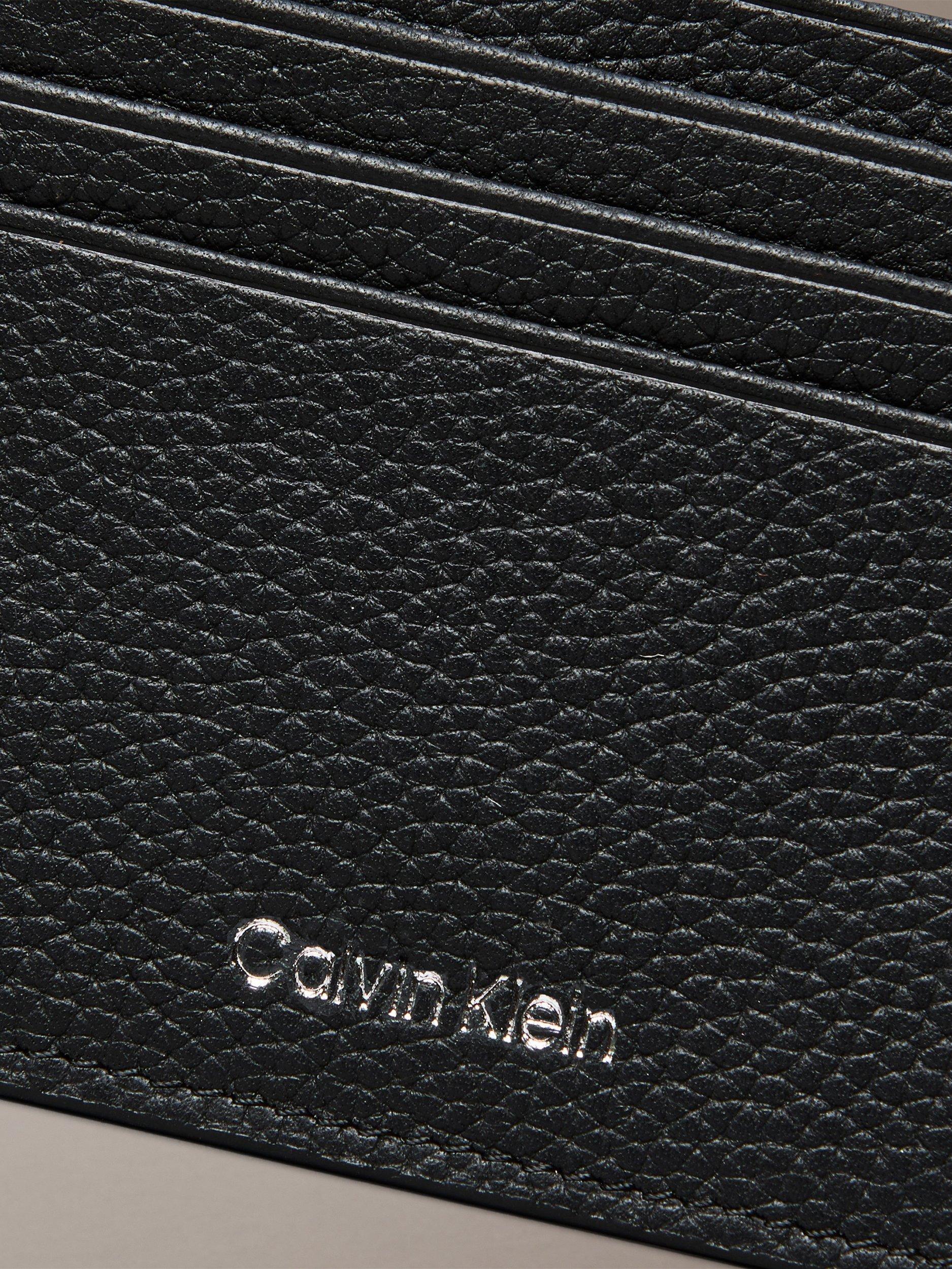 Product image 3 of 3, which shows Calvin Klein Embossed Logo Card Holder, Black, One Size