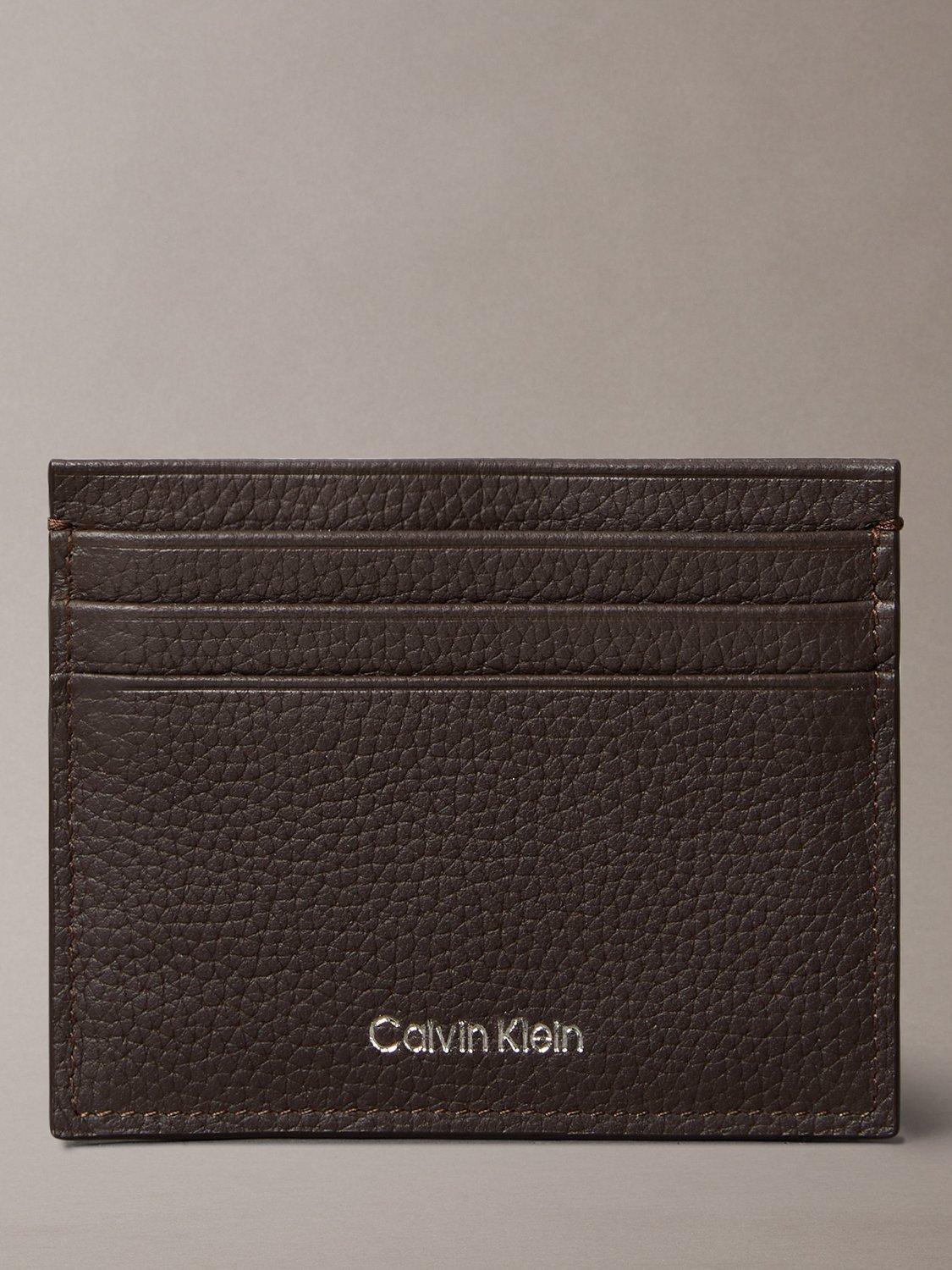 Product image 1 of 4, which shows Calvin Klein Embossed Logo Card Holder, Ck Dark Brown, One Size