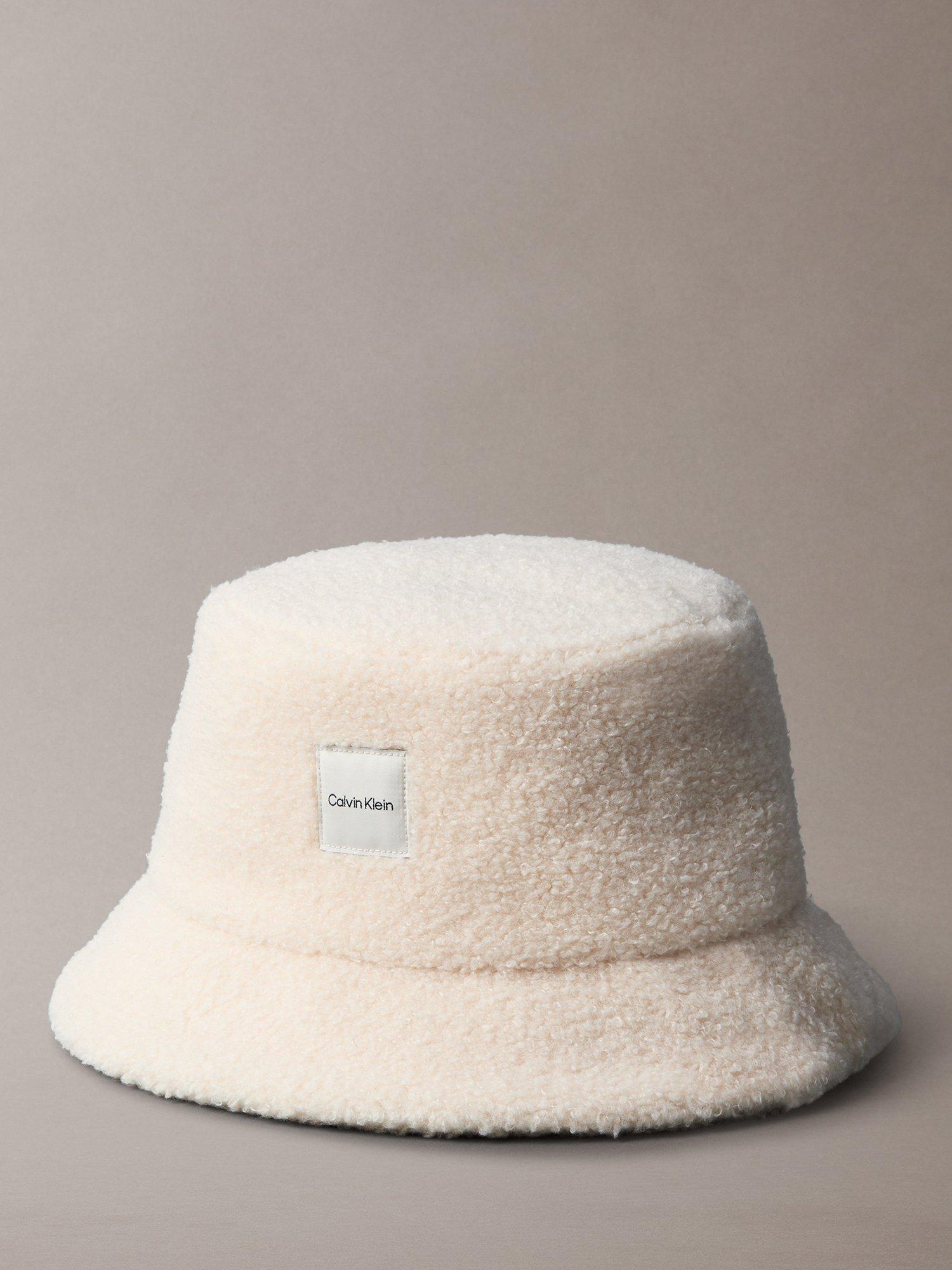 Product image 1 of 3, which shows Calvin Klein Logo Boucle Bucket Hat, Birch, One Size