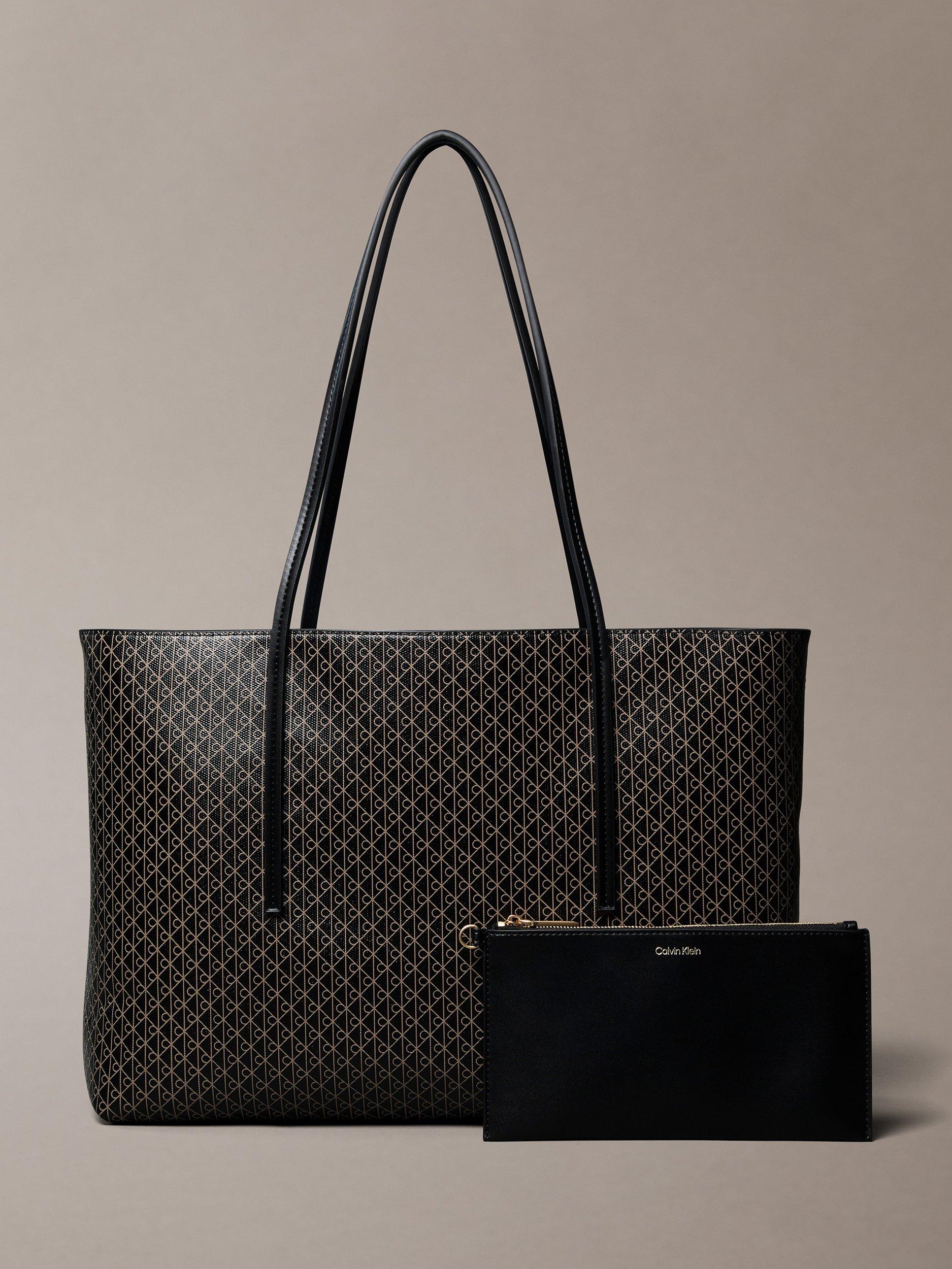 Product image 1 of 4, which shows Calvin Klein Monogram Logo Tote Bag with Pouch, Black, One Size