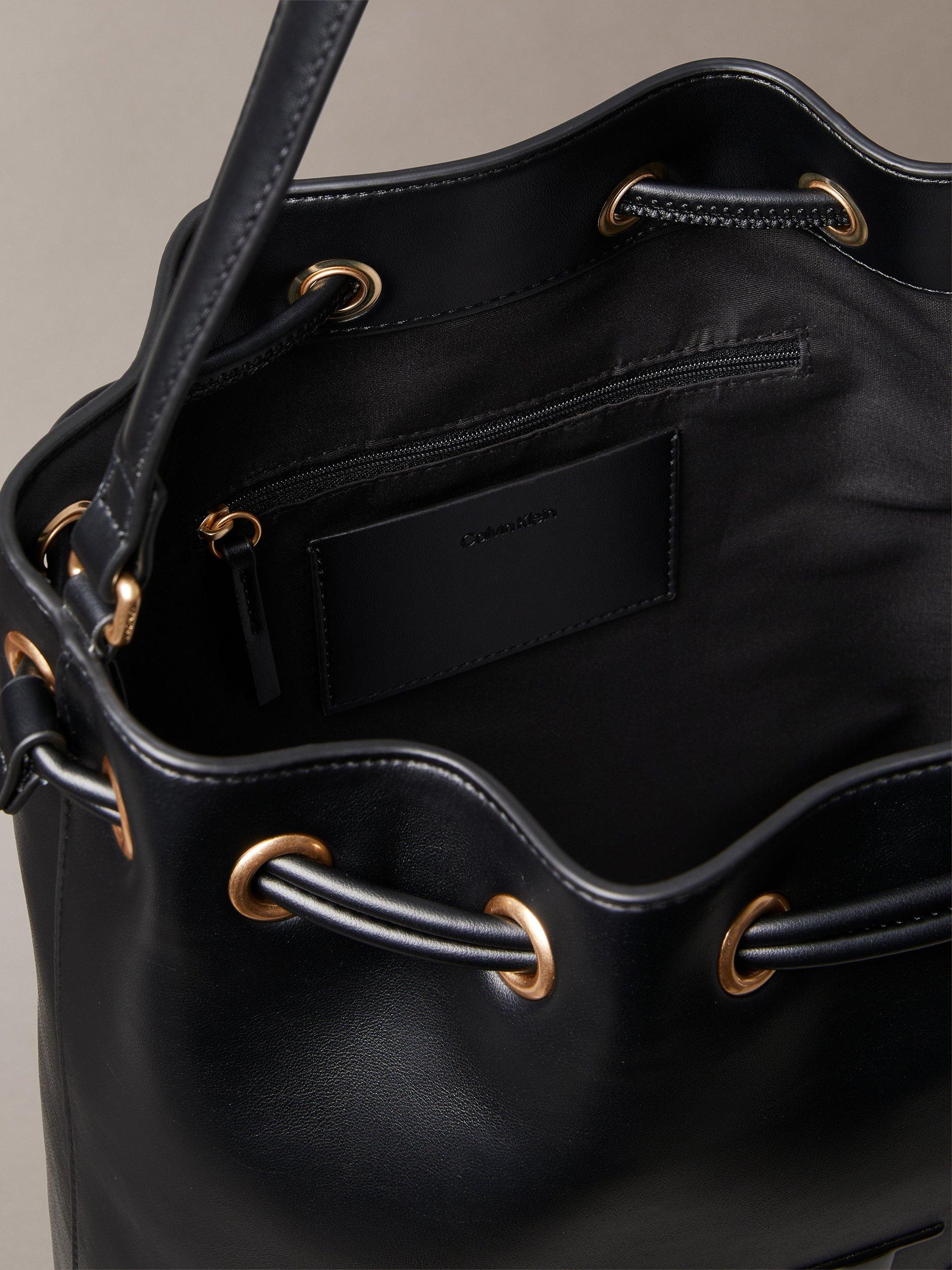 Product image 3 of 4, which shows Calvin Klein Sandi Embossed Monogram Logo Bucket Bag, Black, One Size
