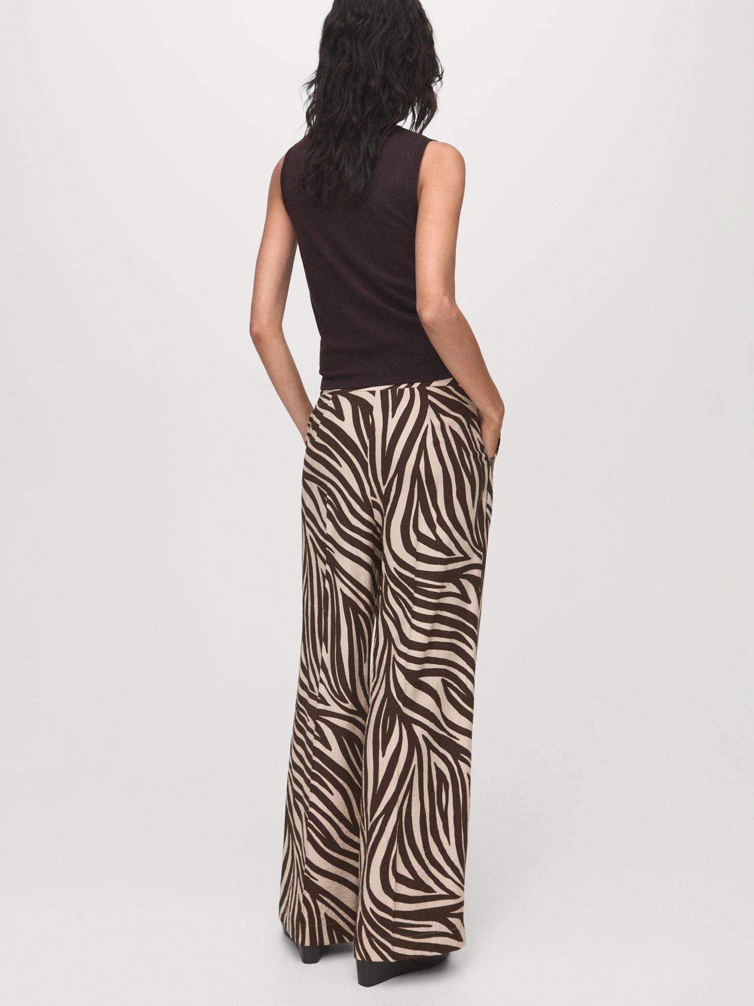 Product image 4 of 8, which shows Mango Nikita Zebra Print Trousers, Black/Brown, 10