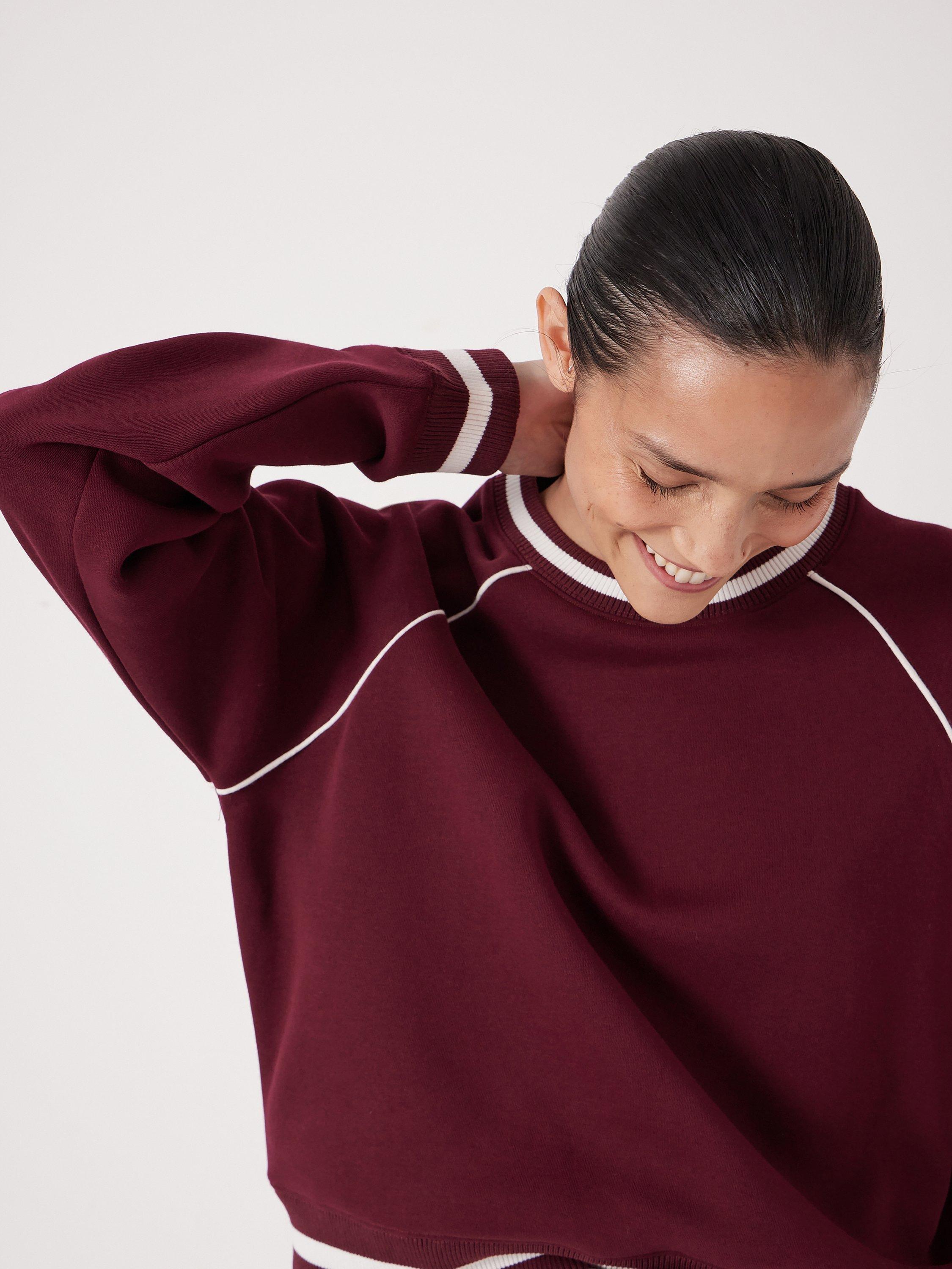 Product image 5 of 5, which shows HUSH Stripe Rib Raglan Sleeve Sweatshirt, Wine Red, XS-S