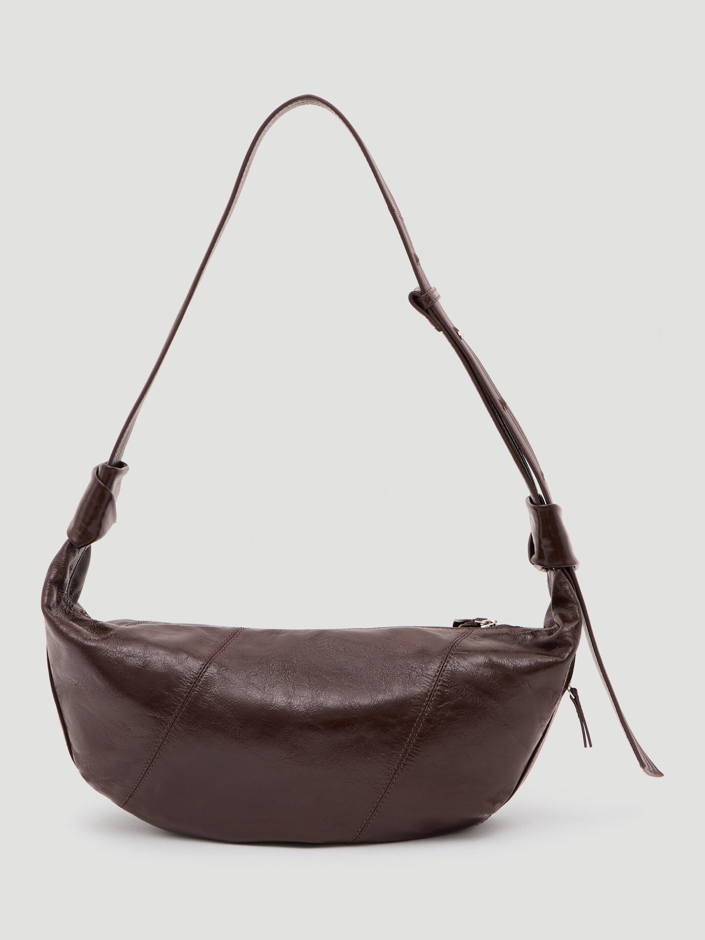Product image 1 of 6, which shows HUSH Leather Crescent Boho Bag, Chocolate, One Size