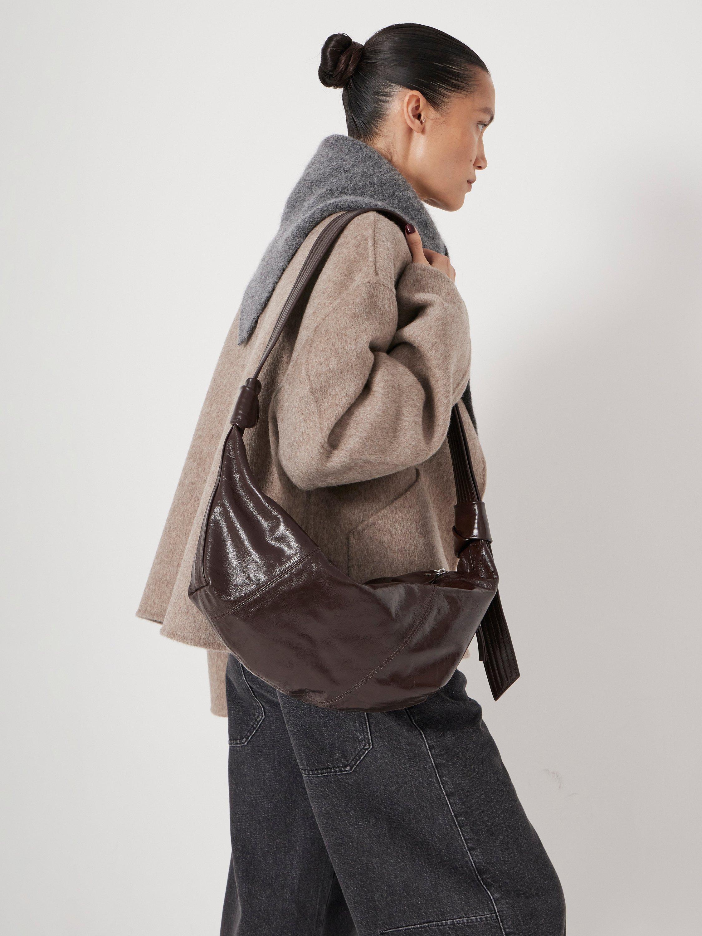 Product image 2 of 6, which shows HUSH Leather Crescent Boho Bag, Chocolate, One Size